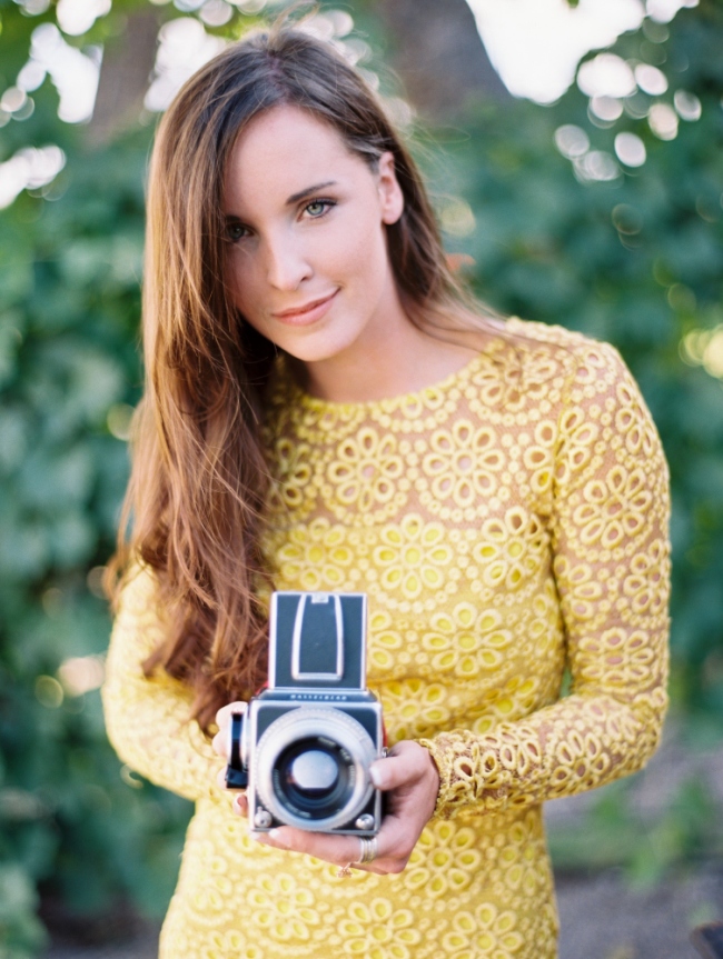 girl in yellow dress holding a hasselblad film camera