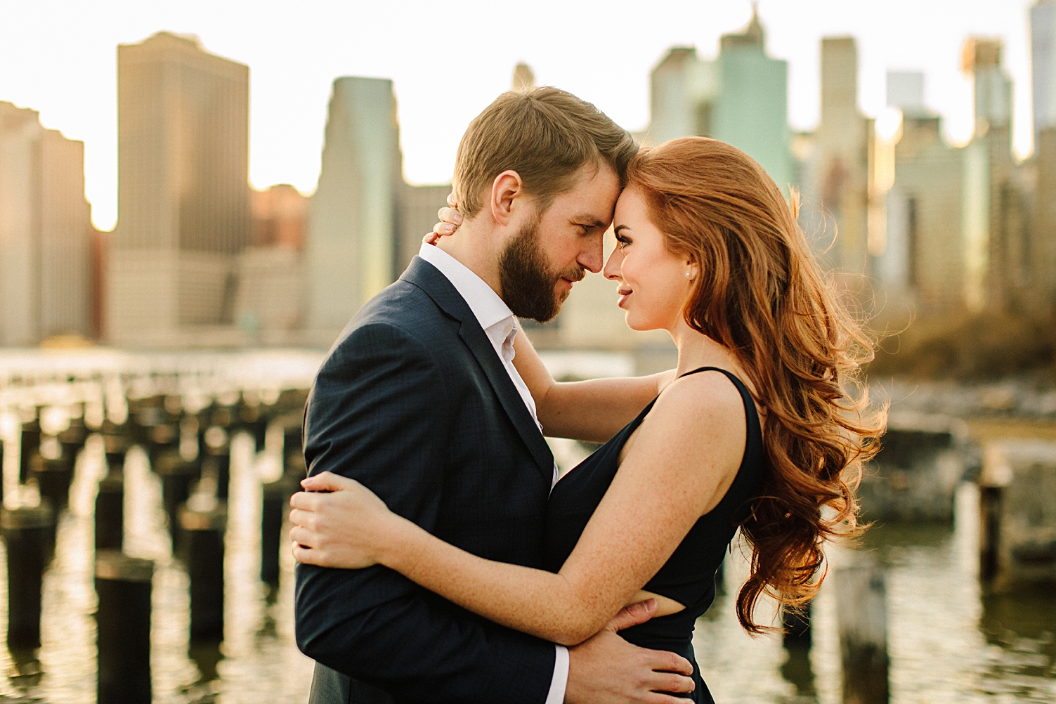 NYC Wedding venues couple embracing in front of skyline