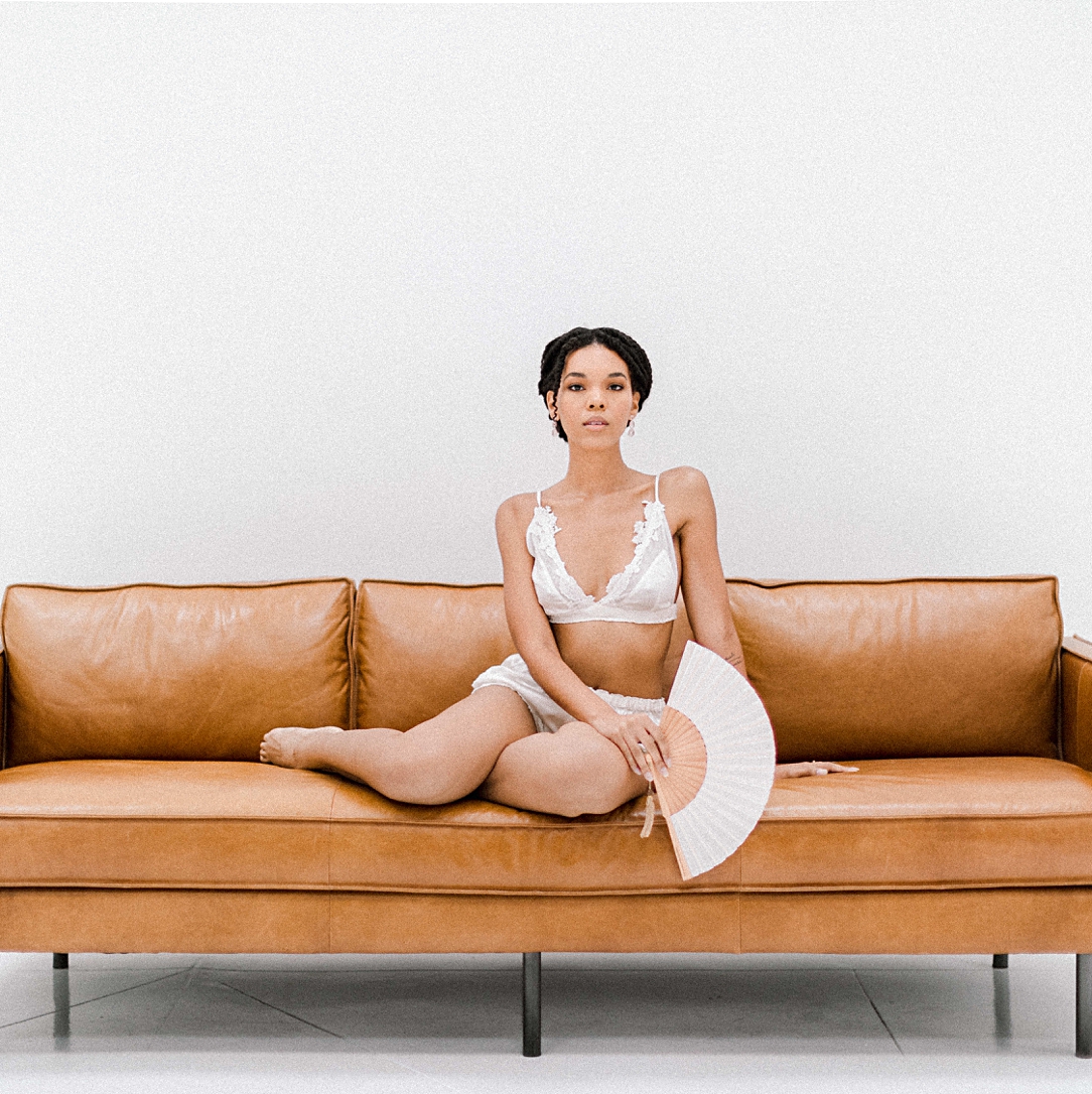Fine art Boudoir girl on couch lingerie