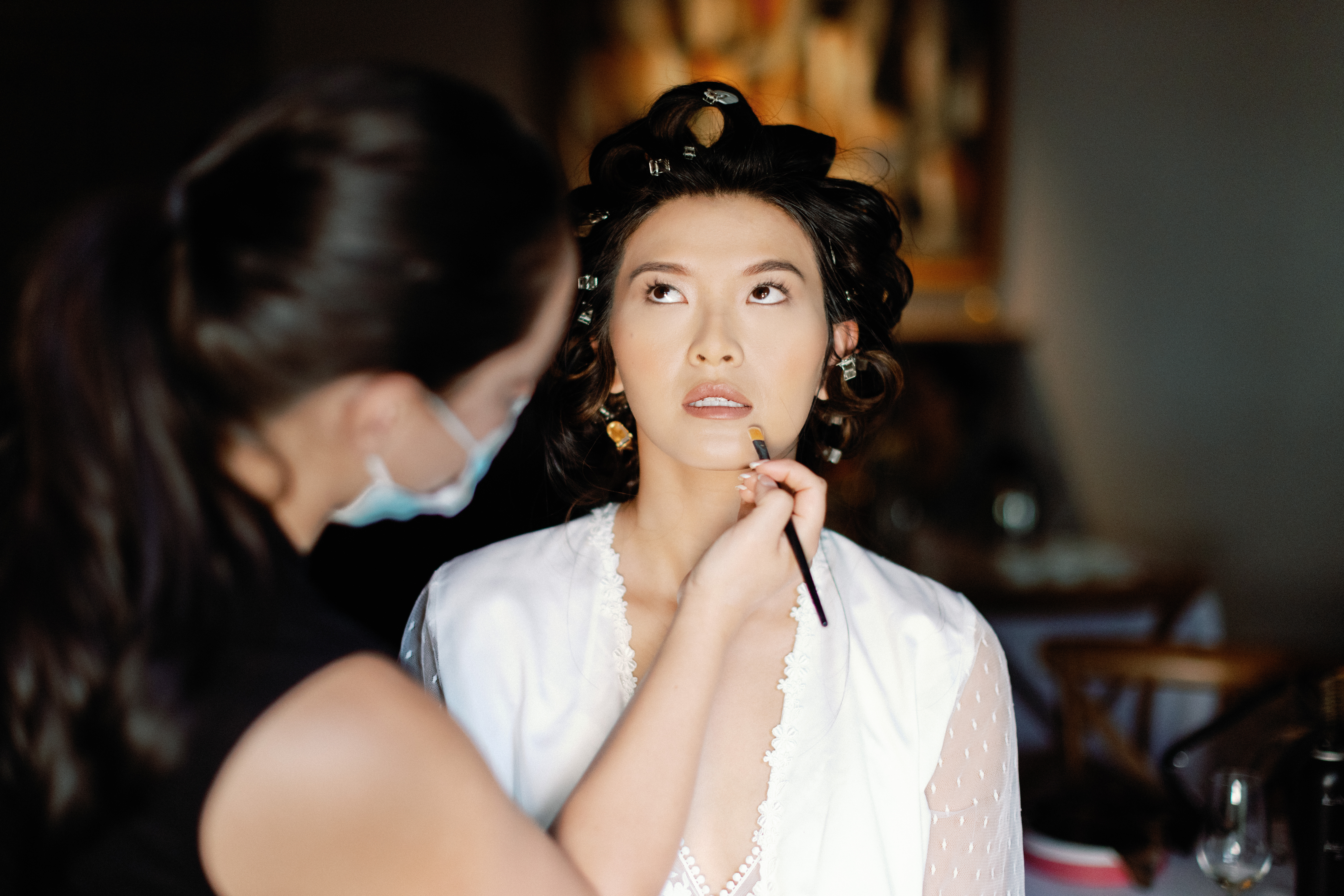 Bride having hair and makeup done