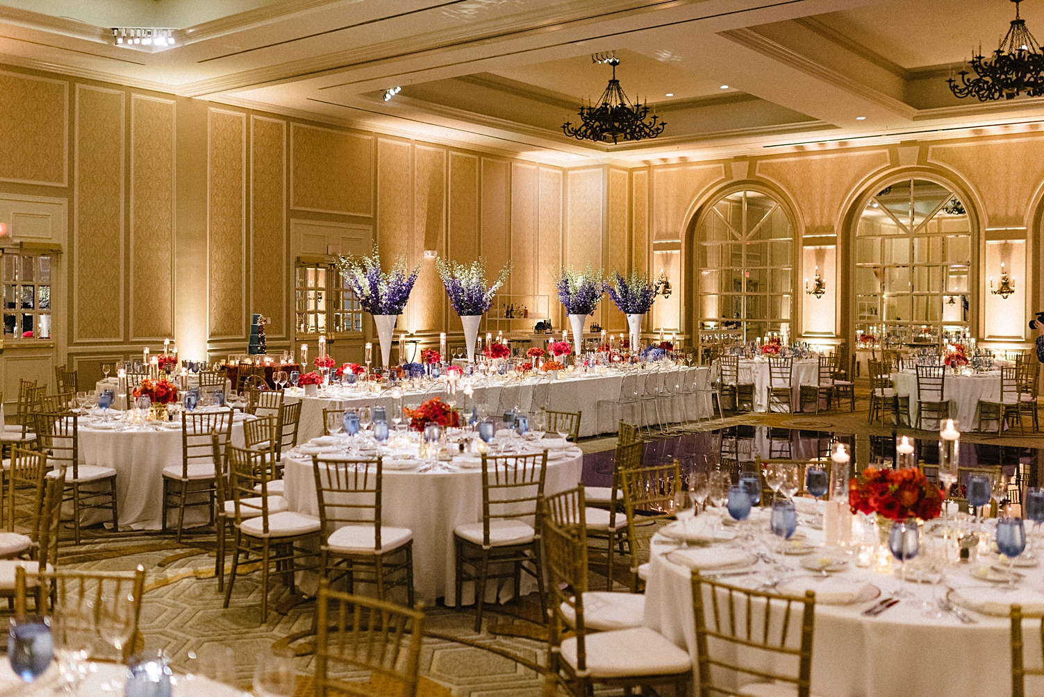 adolphus hotel wedding reception tables blue and red flowers