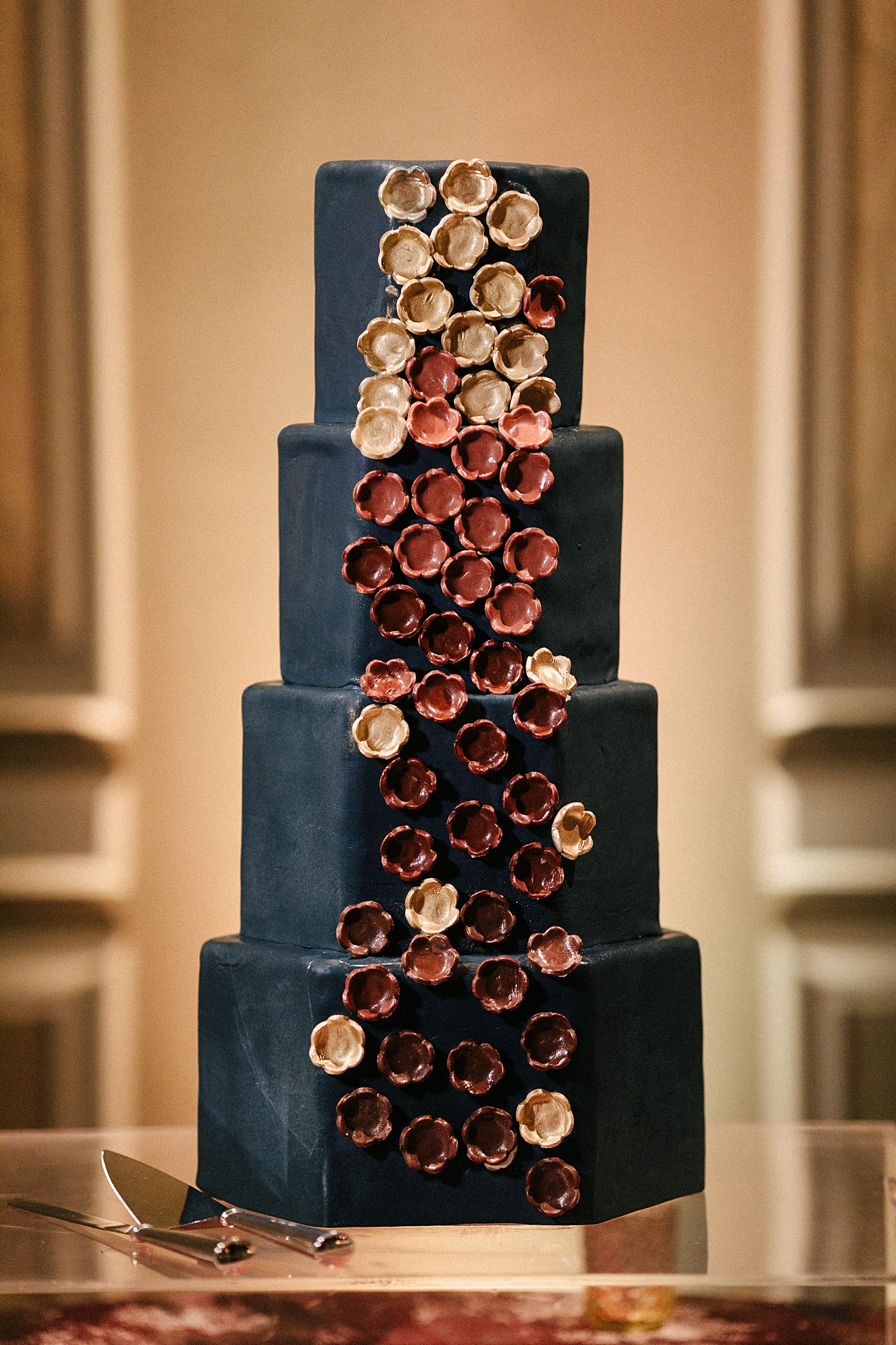 Adolphus Hotel wedding blue, red, and gold 4 tier cake