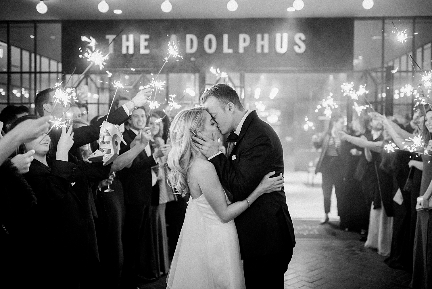 Adolphus hotel wedding couple kissing sparkler