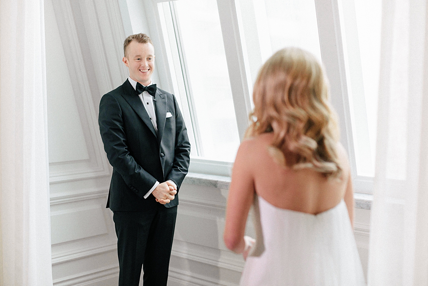 groom in tuxedo seeing bride for first time