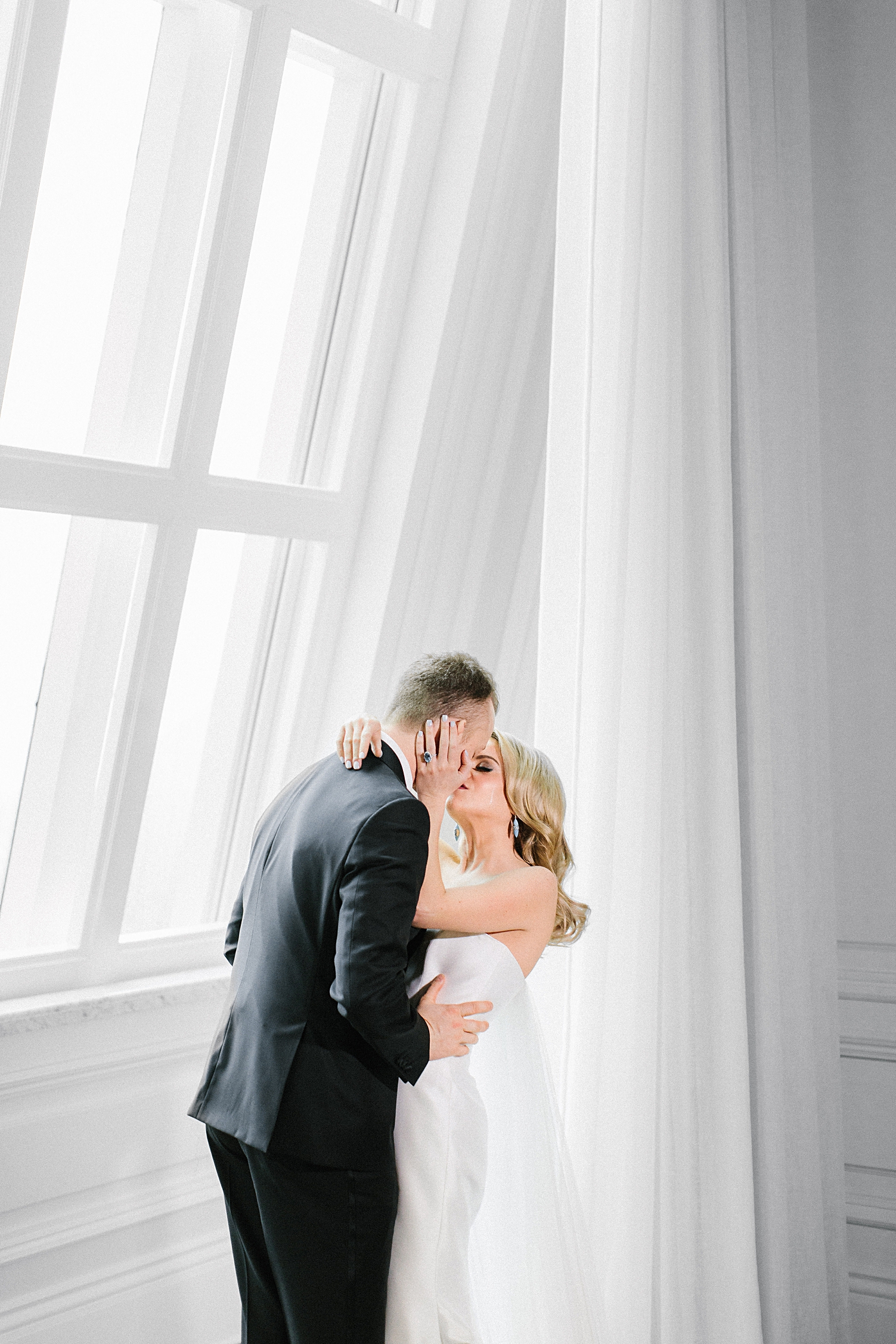classic bride and groom wedding kiss Adolphus Hotel 19th floor Ballroom