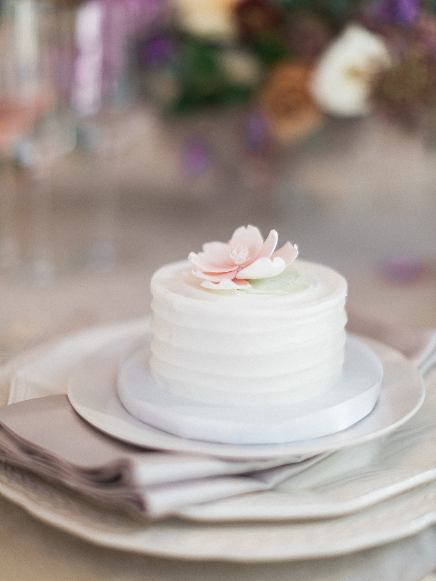 wedding reception small cake dessert with pink flower on top