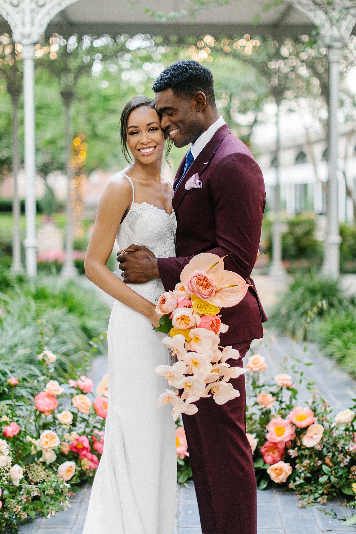 bride and groom holding pink orchid bouquet crescent hotel wedding