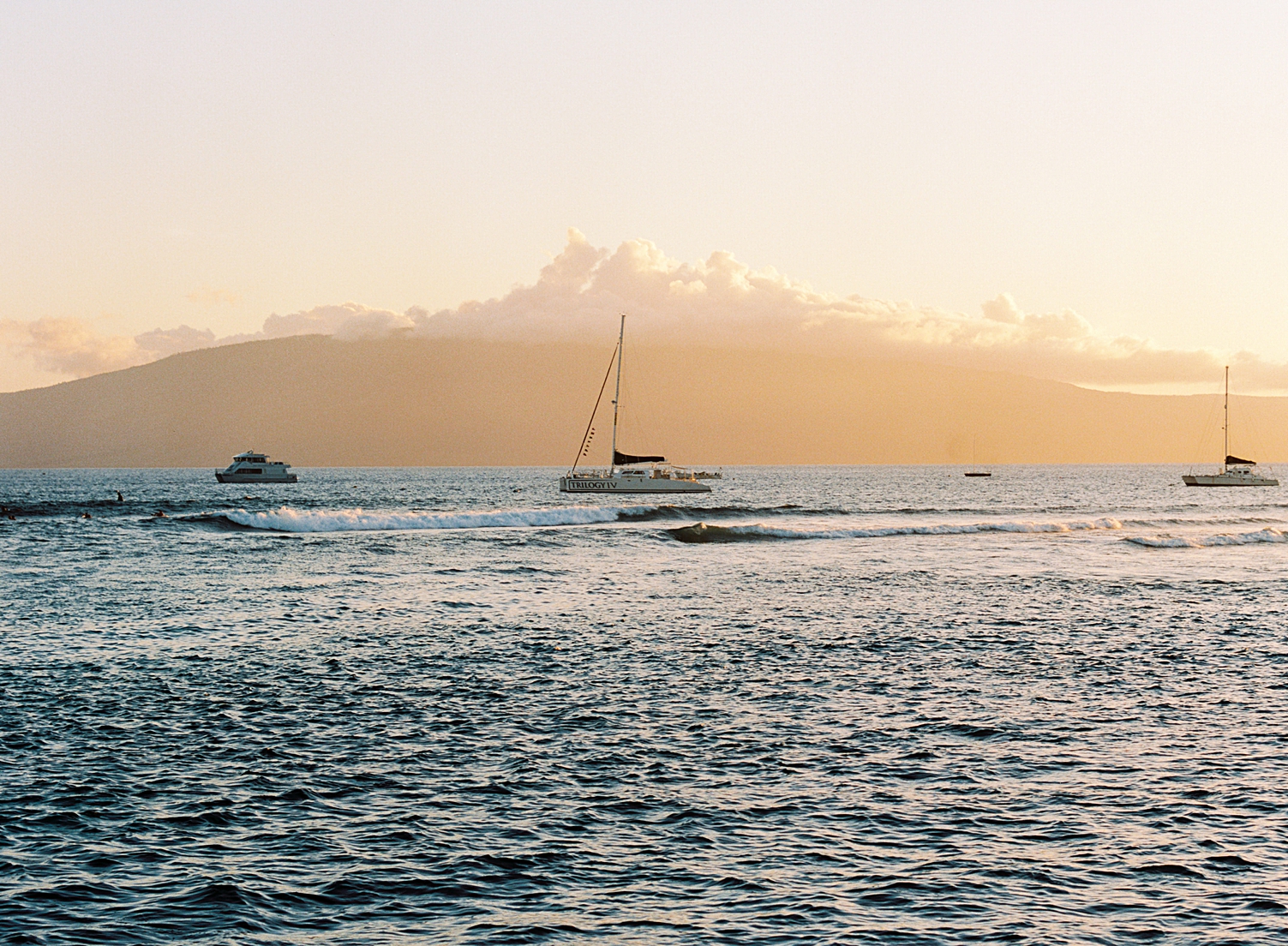 View of Lanai from Lahaina Maui golden Sunset boats