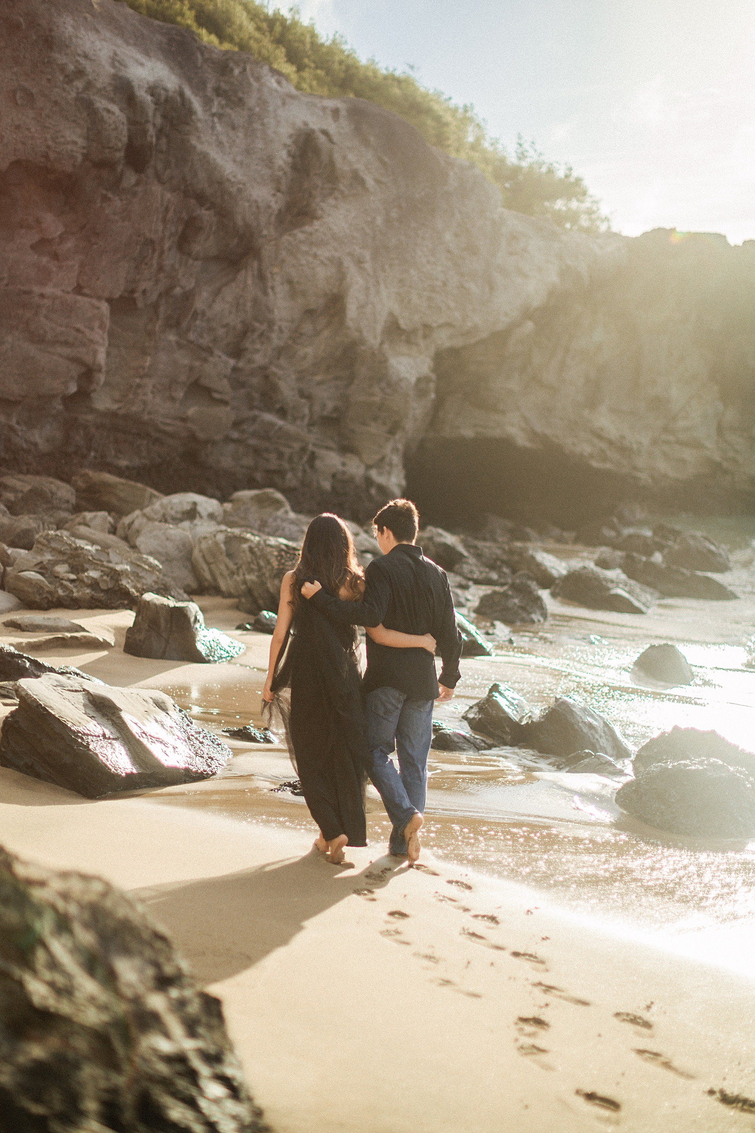 Kuai beach engagement couple in black walking