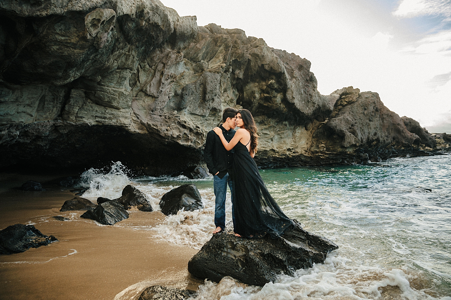 Maui couple in black engagement on beach