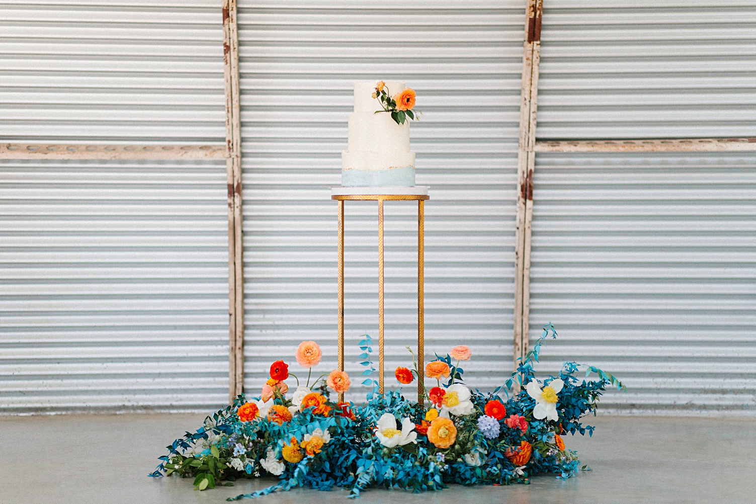 DFW Florist Tersilla Studio blue orange flowers cake instillation