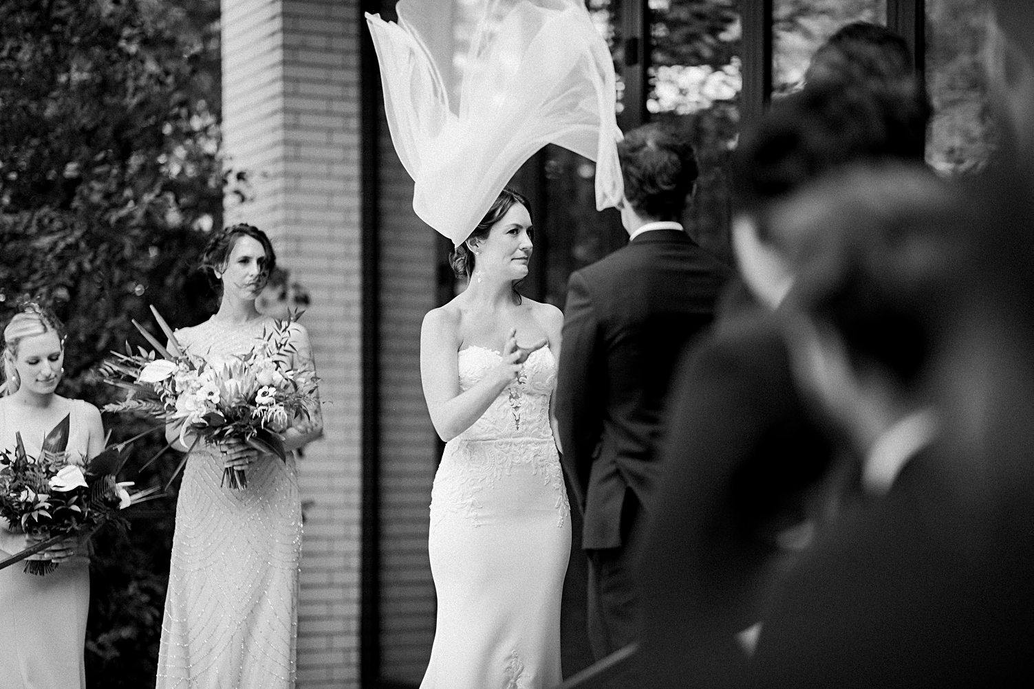 wedding ceremony bride veil blowing in wind