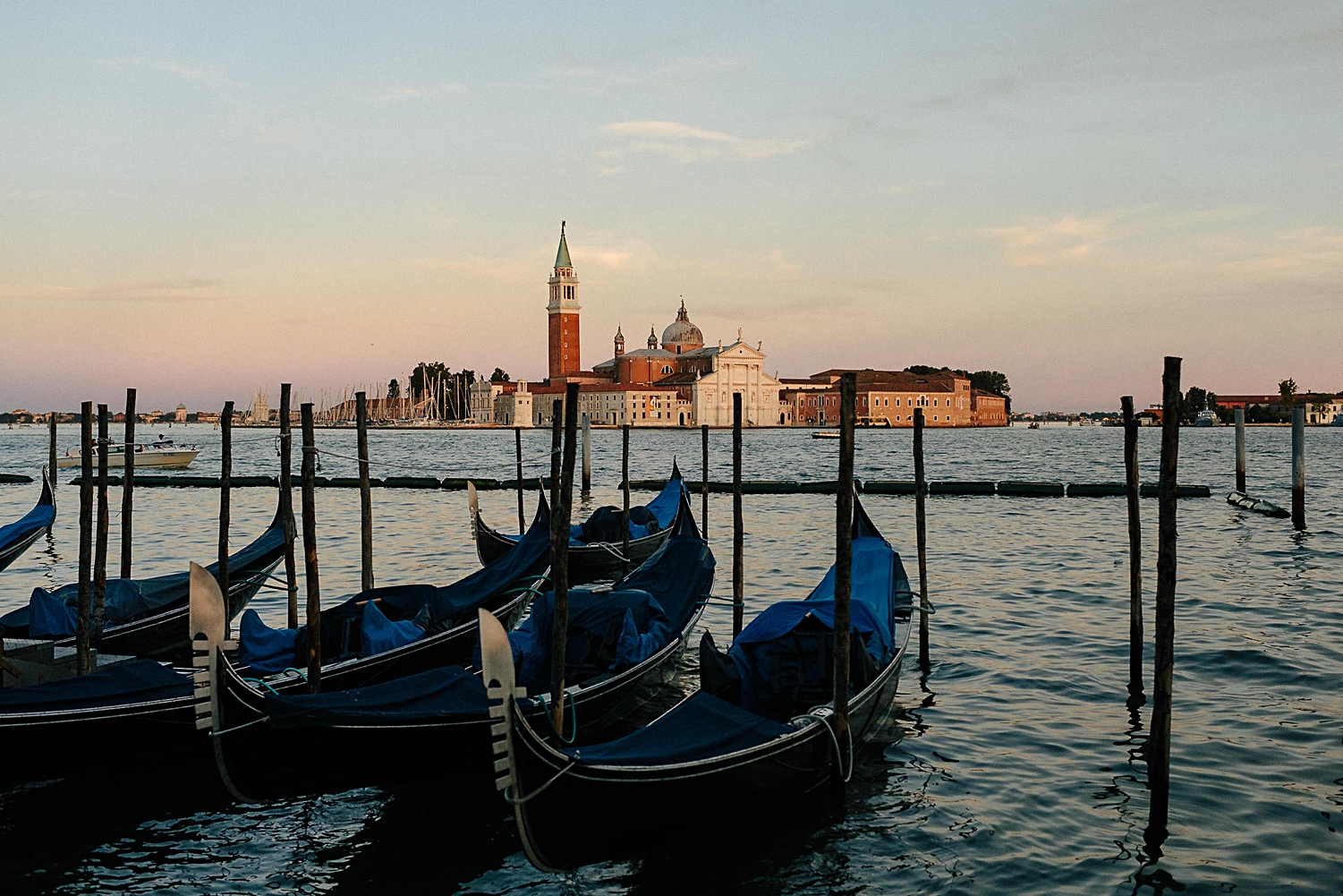 blue gondolas in Venice Grande Canal at sunset Italy