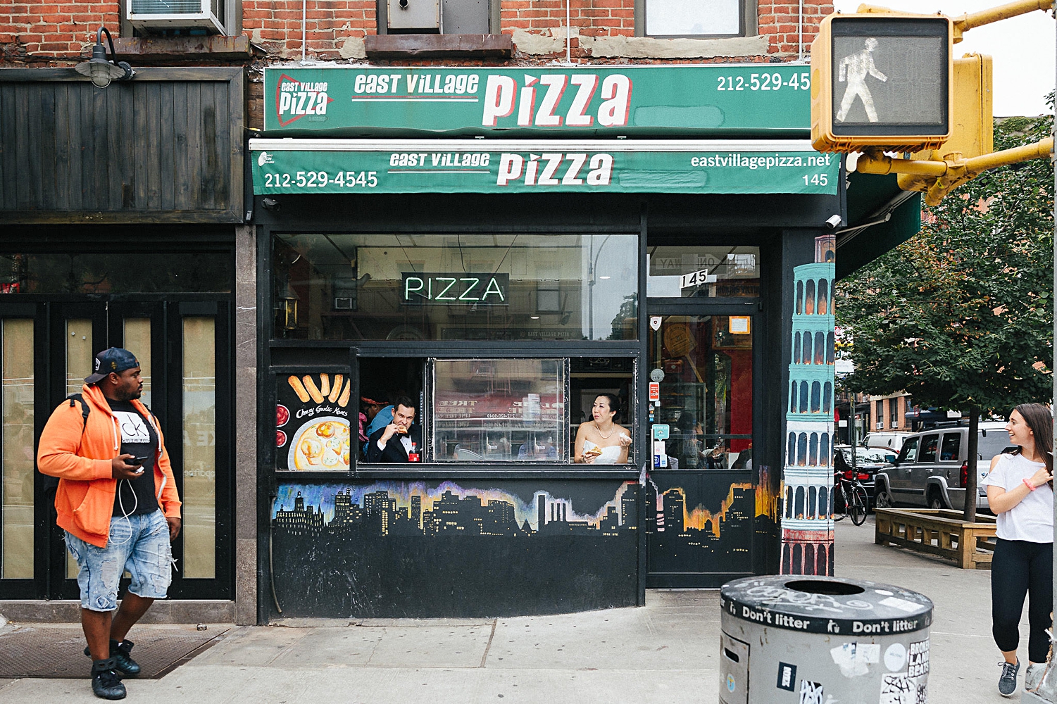 New York City Pizza restaurant sidewalk bride and groom eating out of window