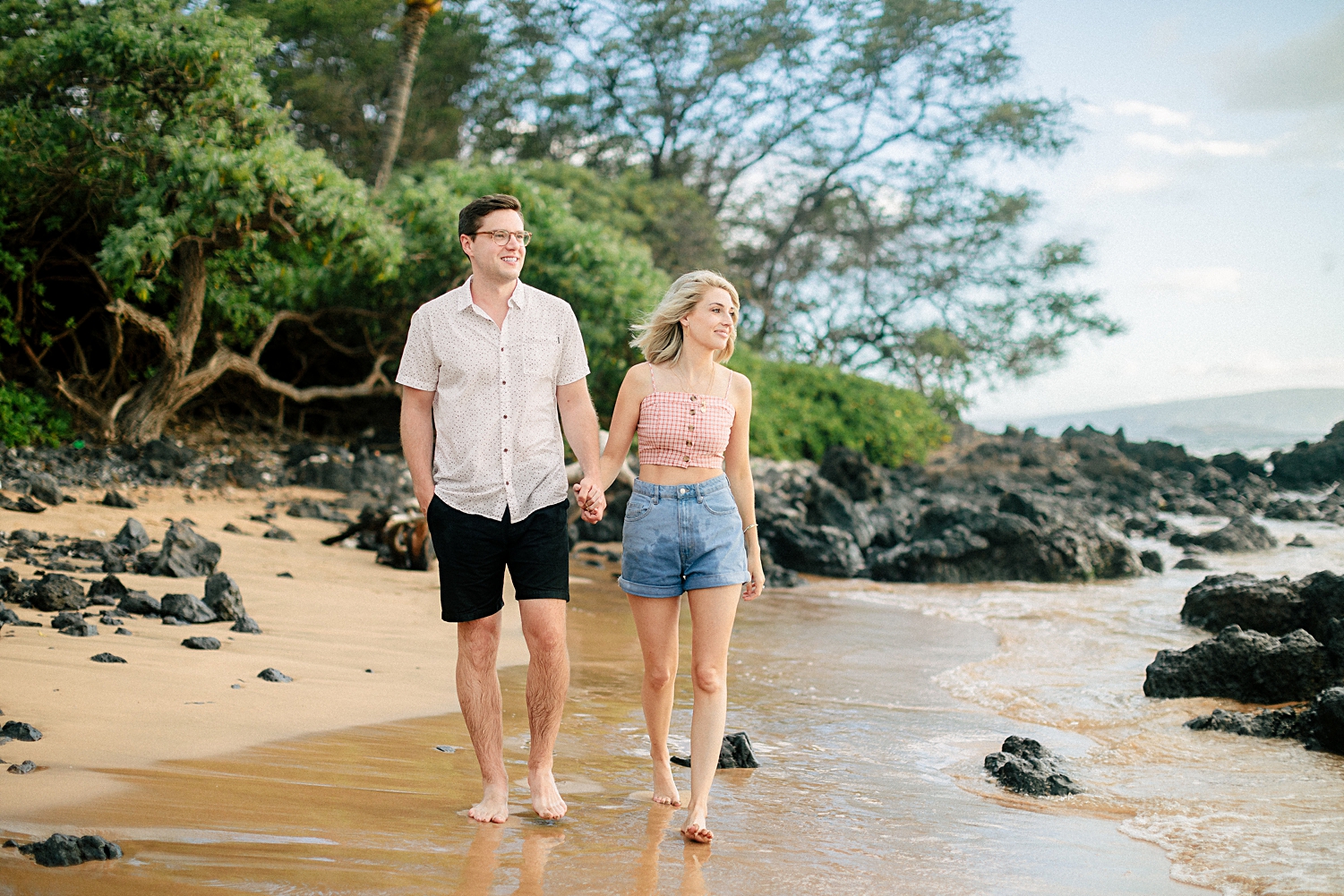couple walking on wailea beach Hawaii