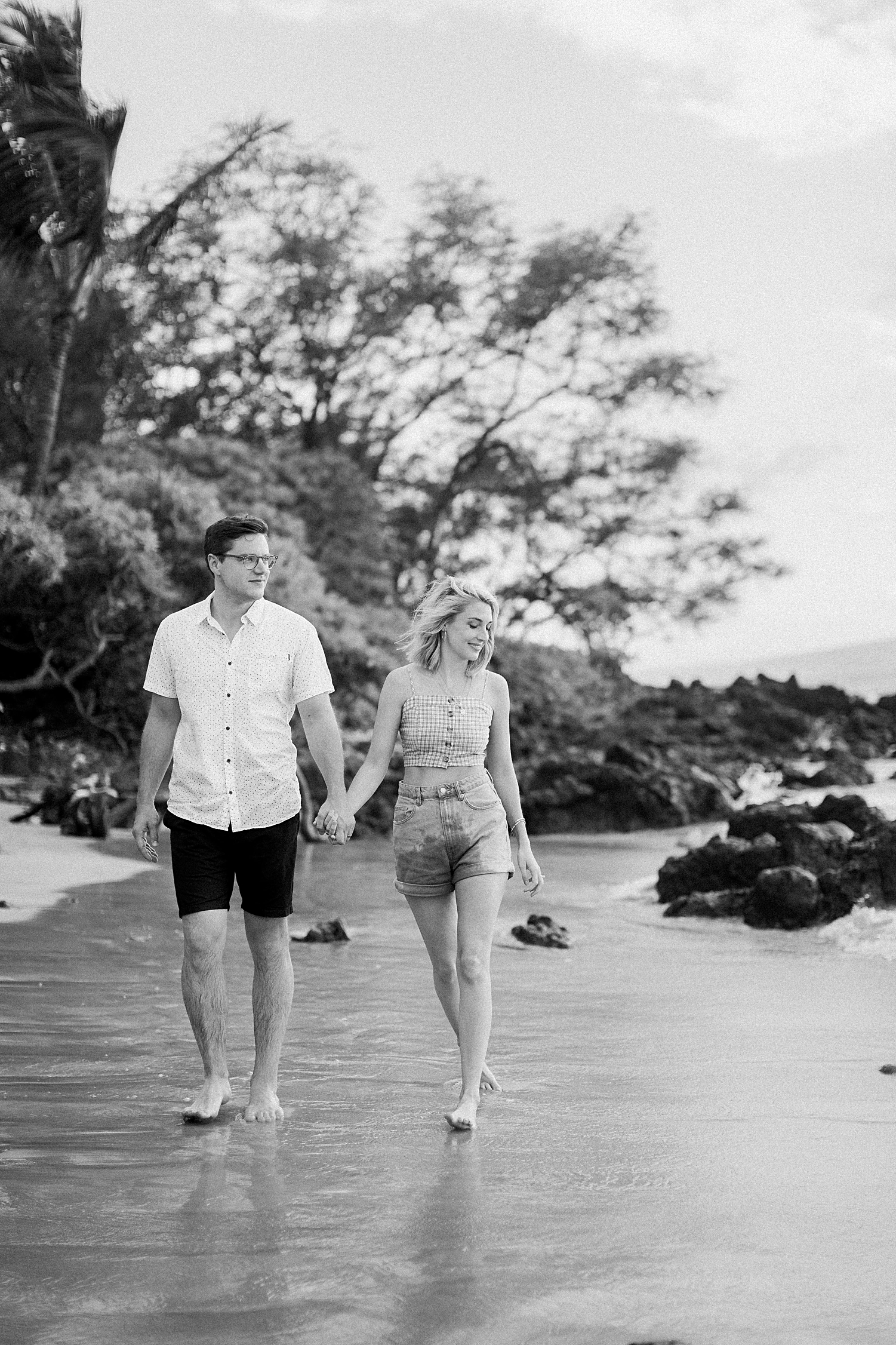 couple walking on Maui beach Hawaii