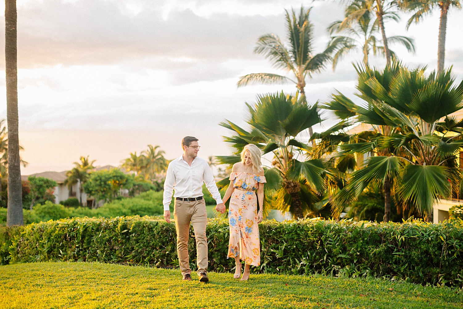 couple walking Hotel Wailea maui garden pink dress destination Hawaii wedding venues