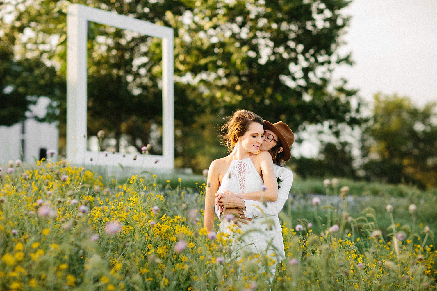 prospect house wedding couple kissing in field of flowers