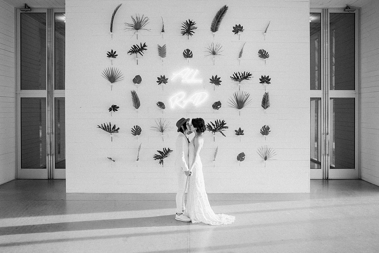 prospect house wedding brides kissing neon sign tropical plants