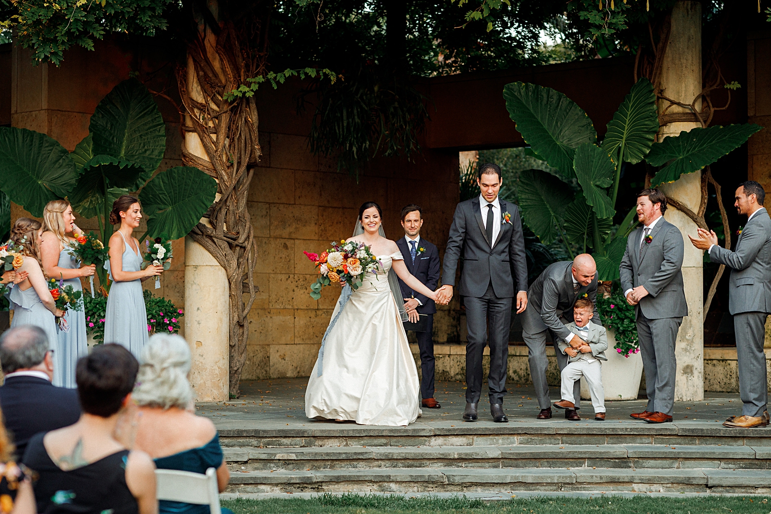 colorful wedding ceremony bride and groom recessional at dallas arboretum