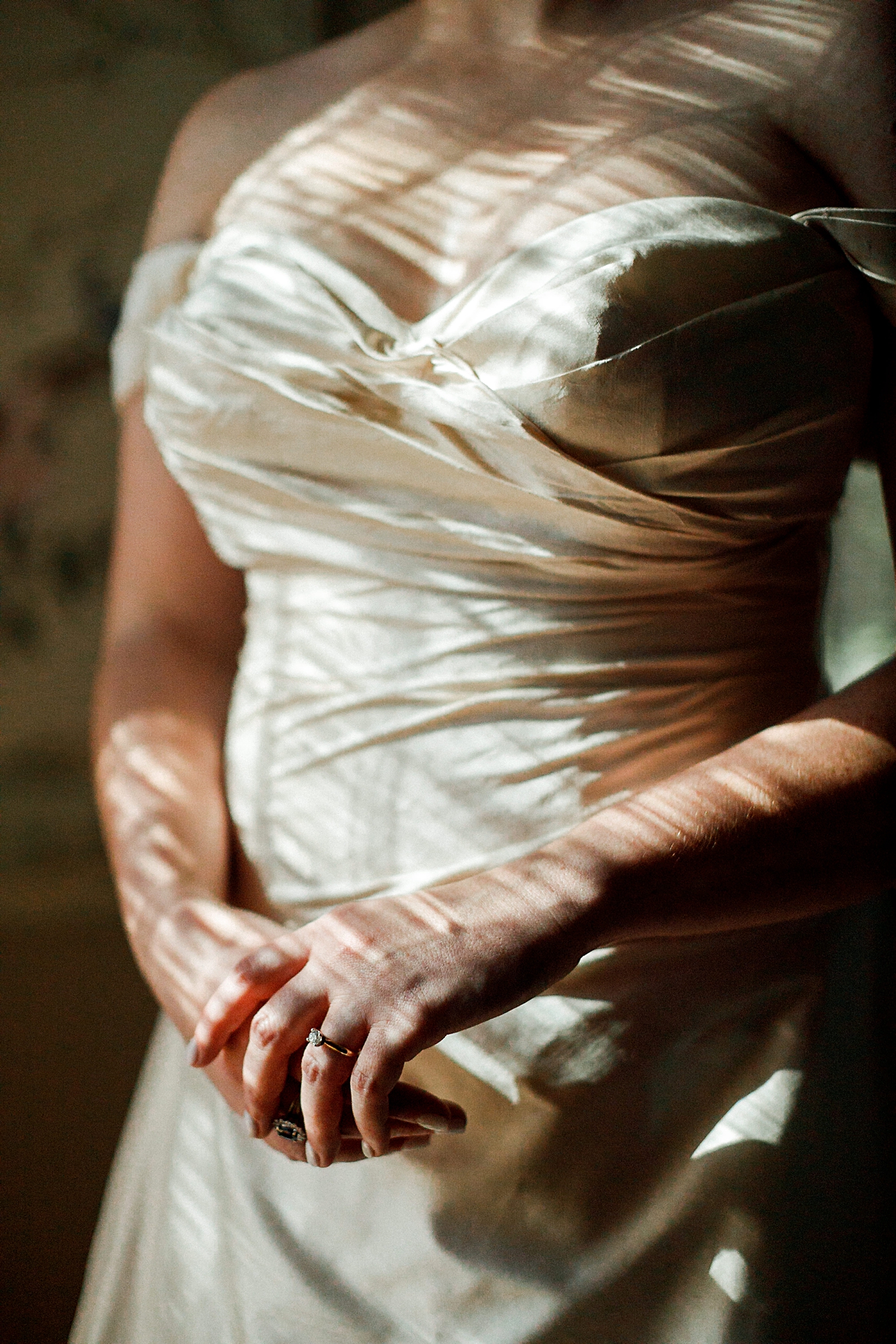 dappled light on bride in wedding dress