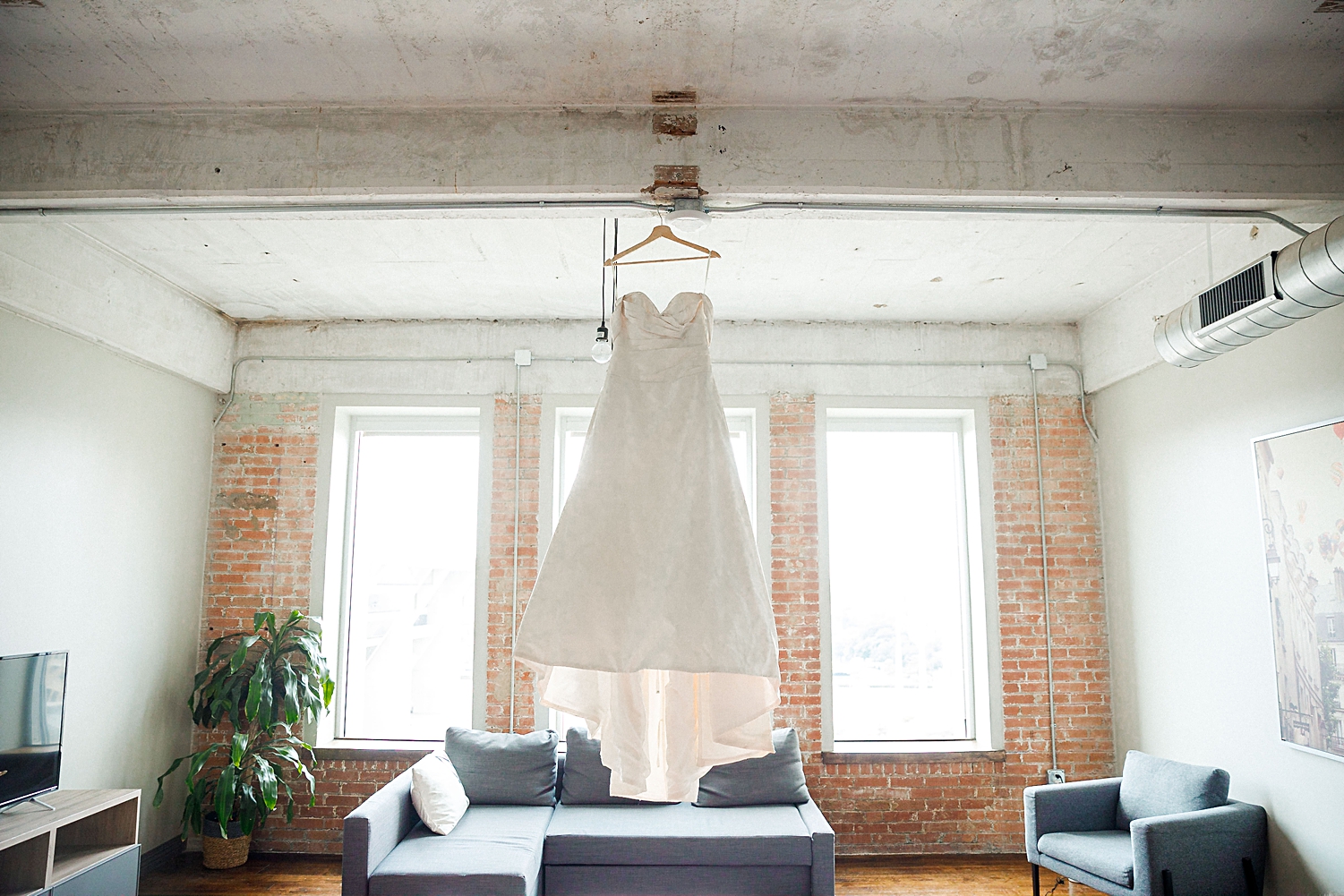 wedding dress hanging from ceiling 