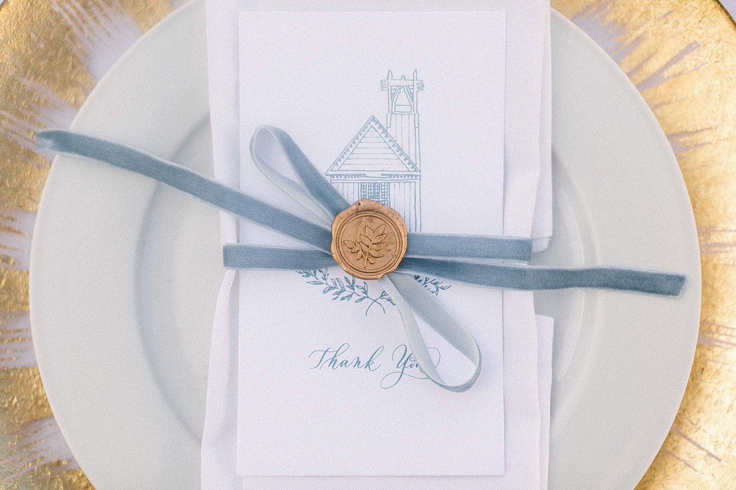 blue and white thank you card on plate featuring Seaside Chapel Florida