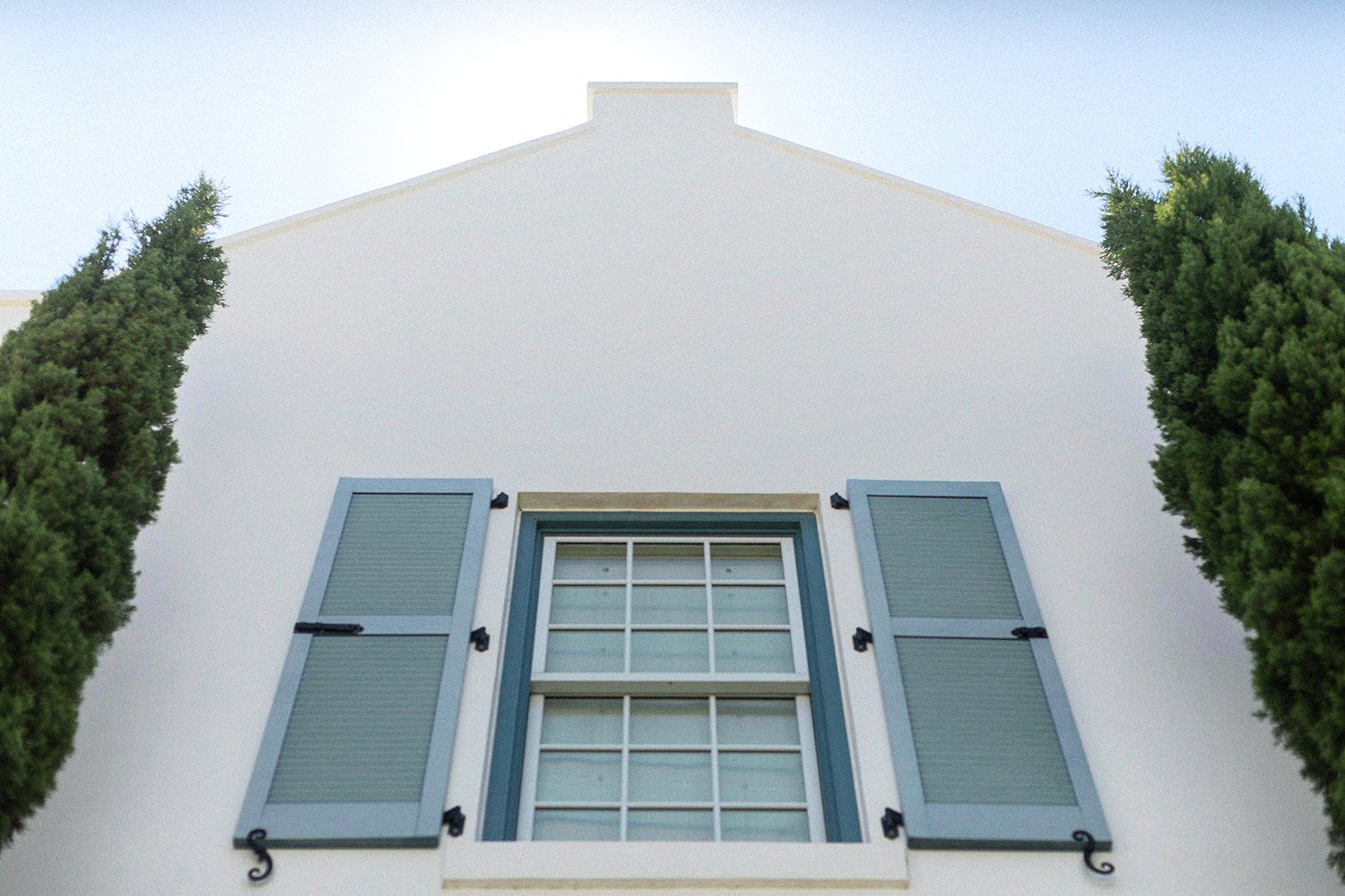 Alys Beach Florida green window shutters on white facade