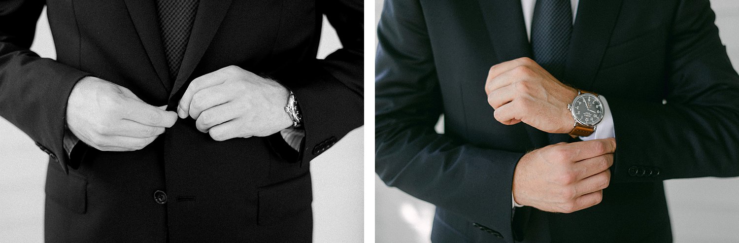 hands on man buttoning suit and shirt cuffs
