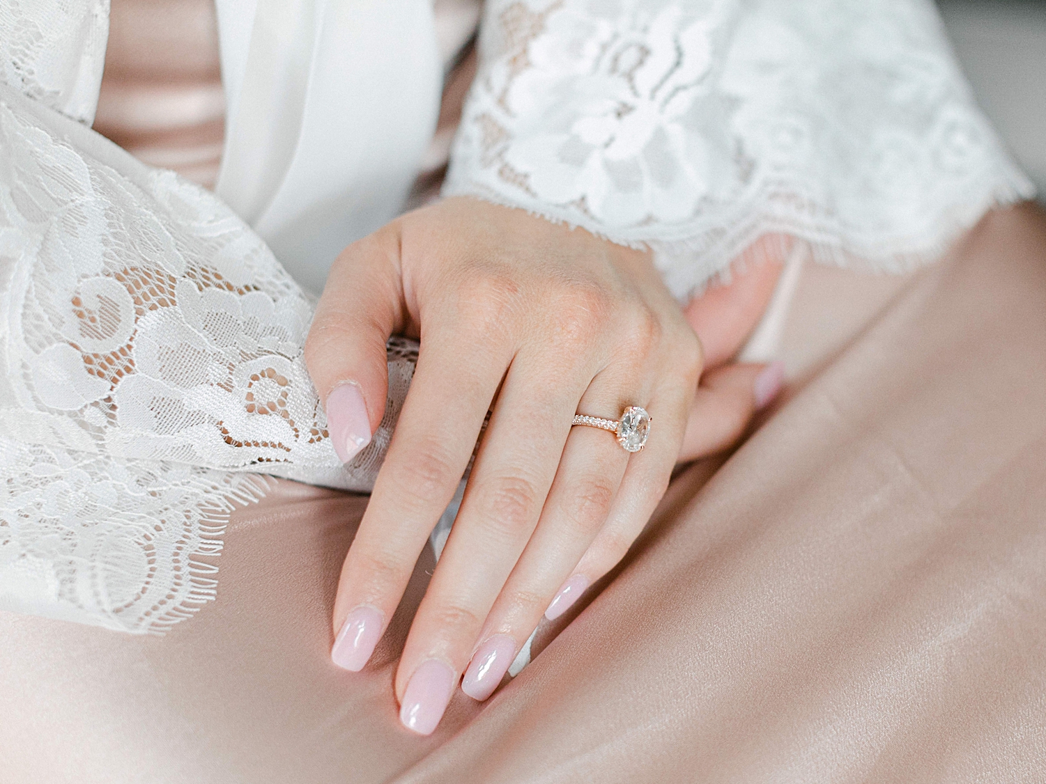 hand on hand with engagement ring 