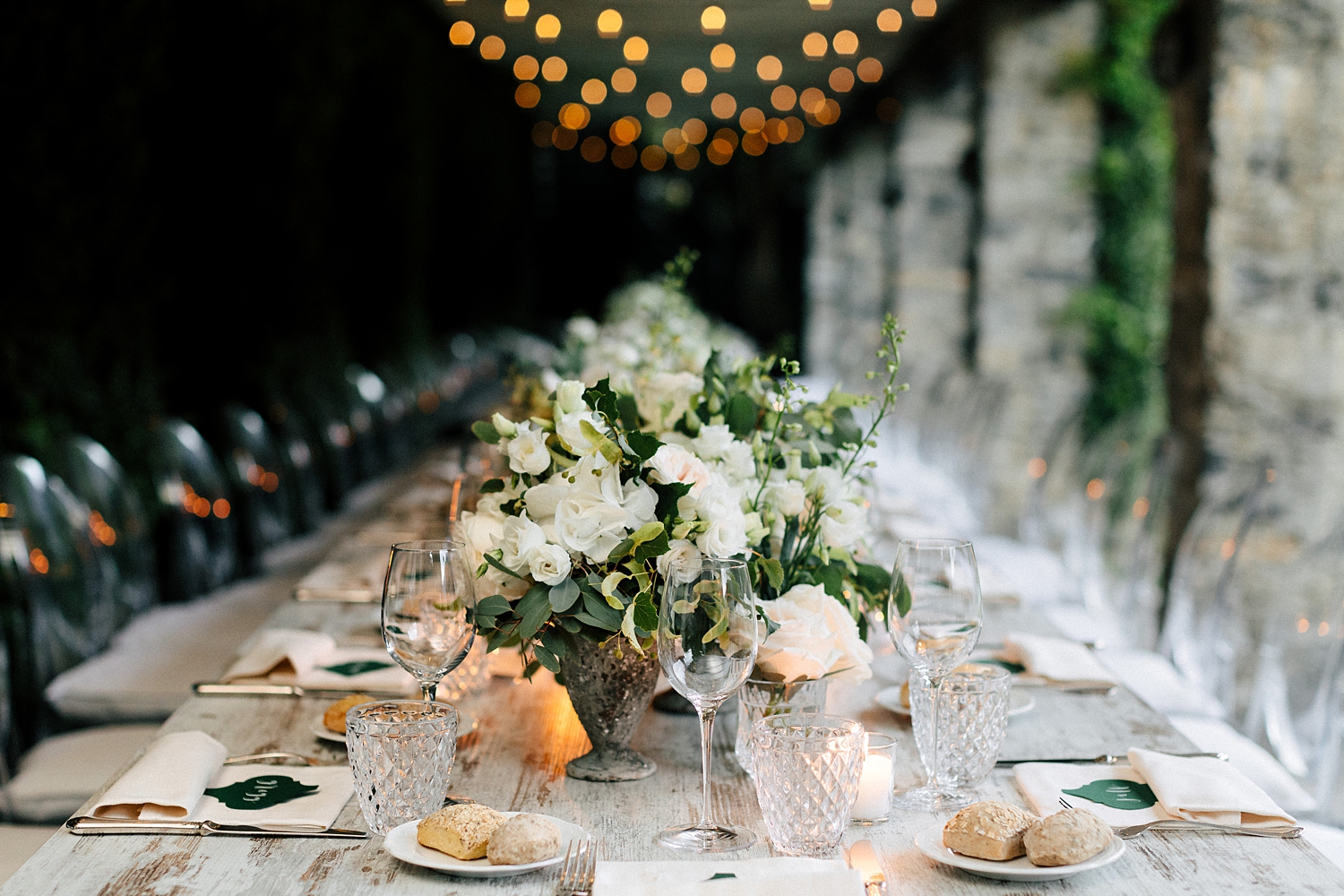 Lake Como Wedding Reception white florals long table under roof of lights