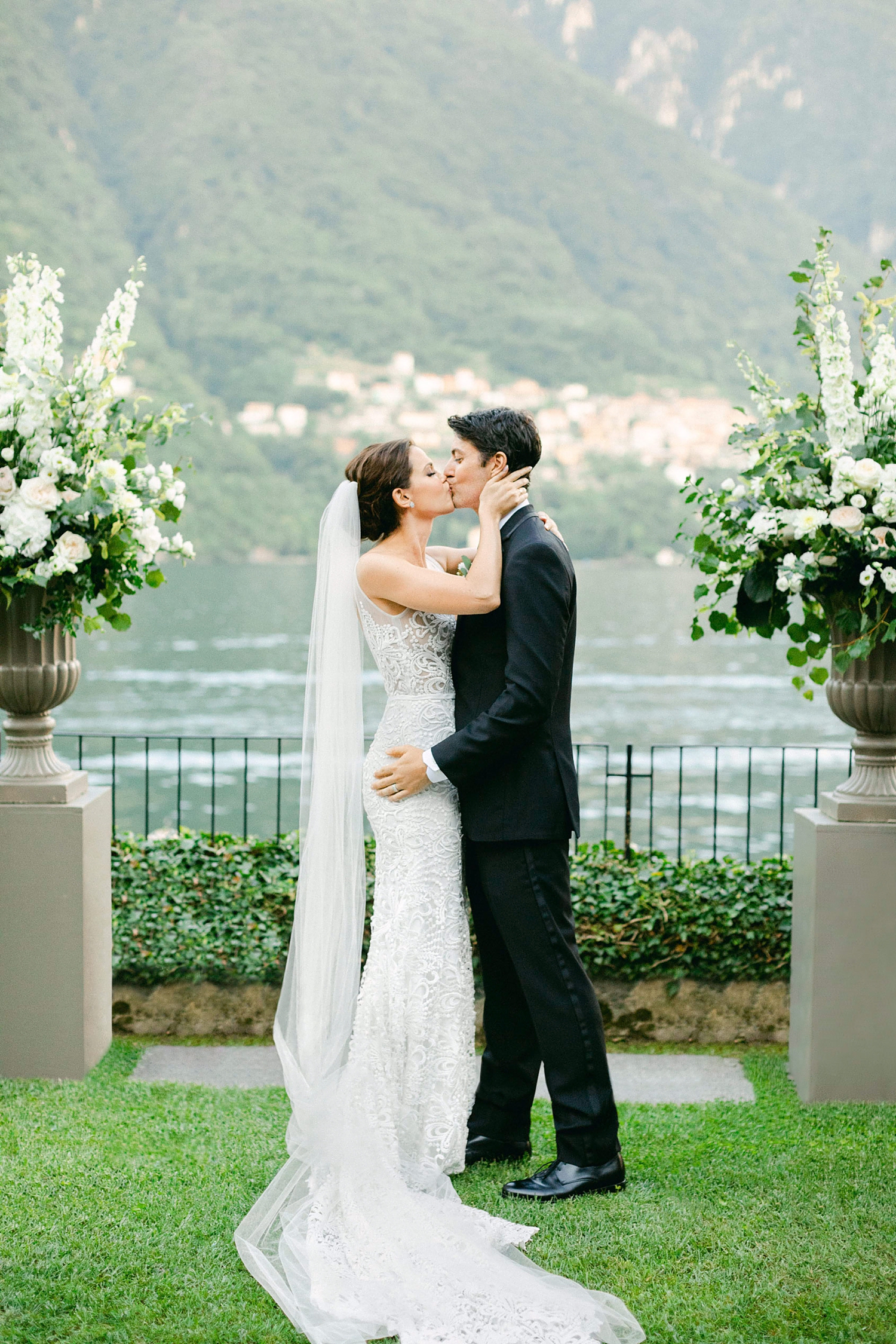 bride and groom first kiss at ceremony at Lake Como Wedding