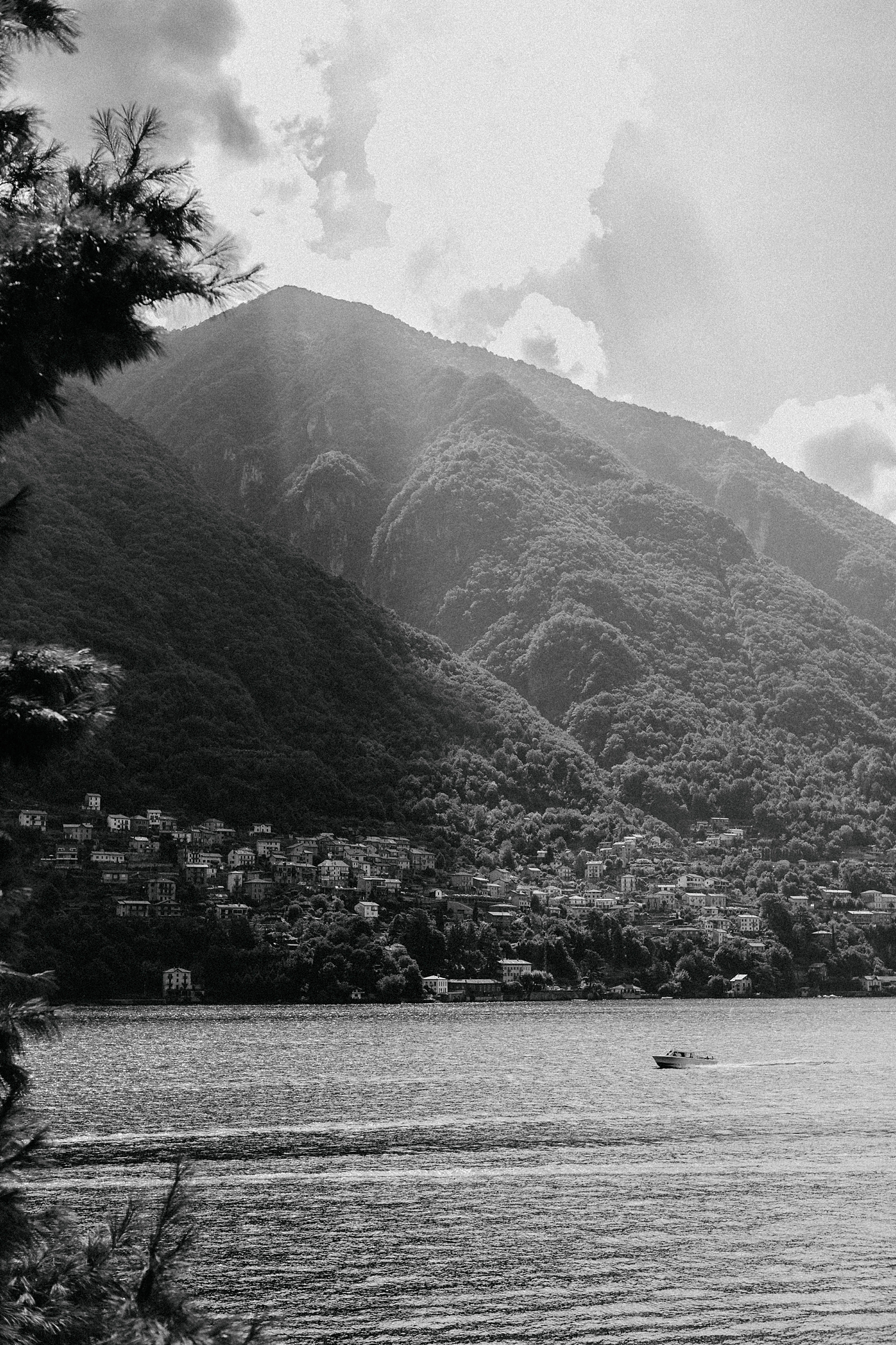Black and white Lake Como Italy village mountain against sky