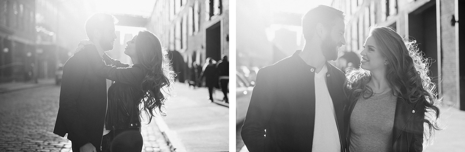 Couple embracing on NYC street at sunset during Brooklyn engagement black and white