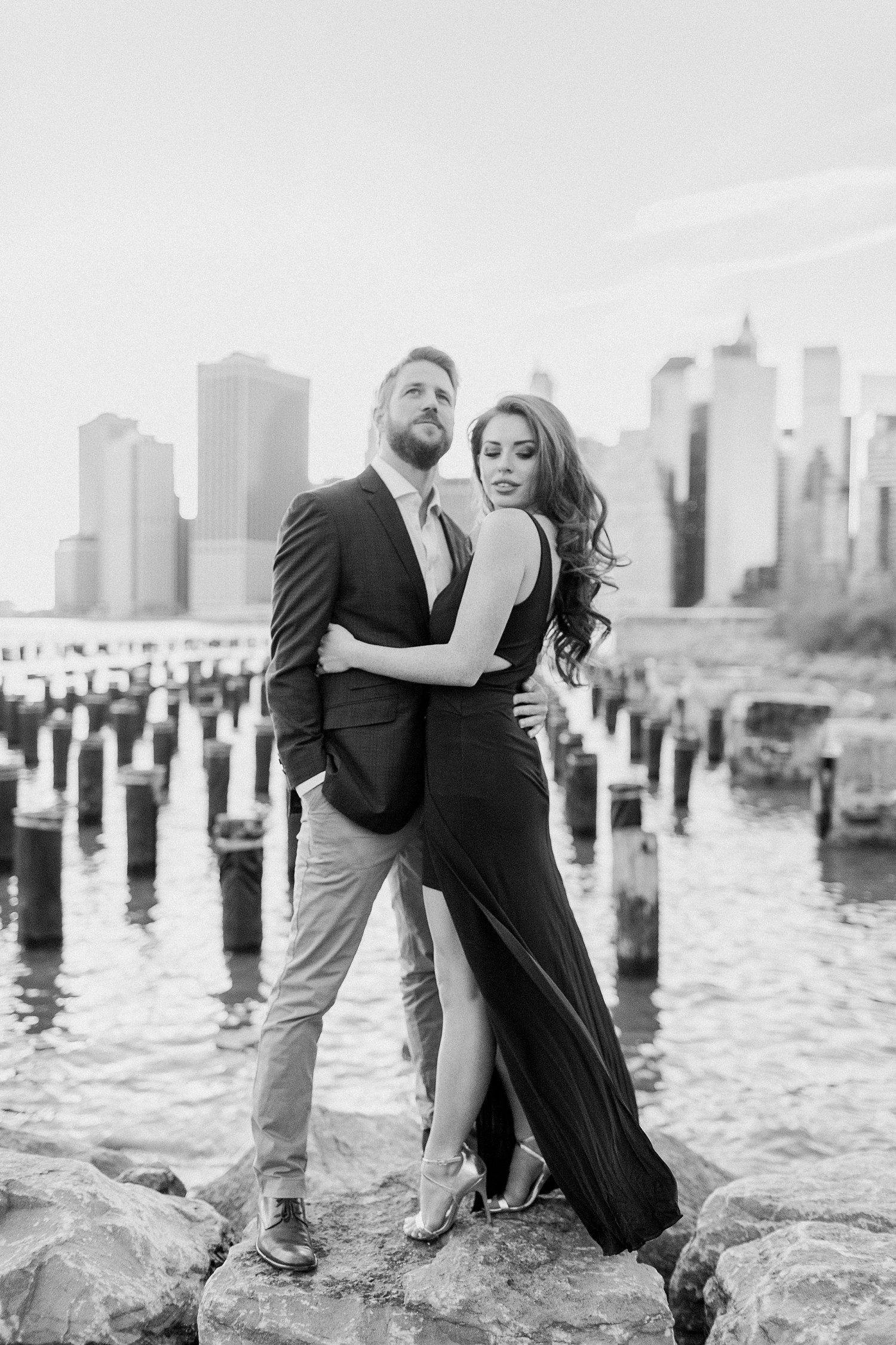 Downtown Manhattan Skyline from Brooklyn pier couple engagement session black and white