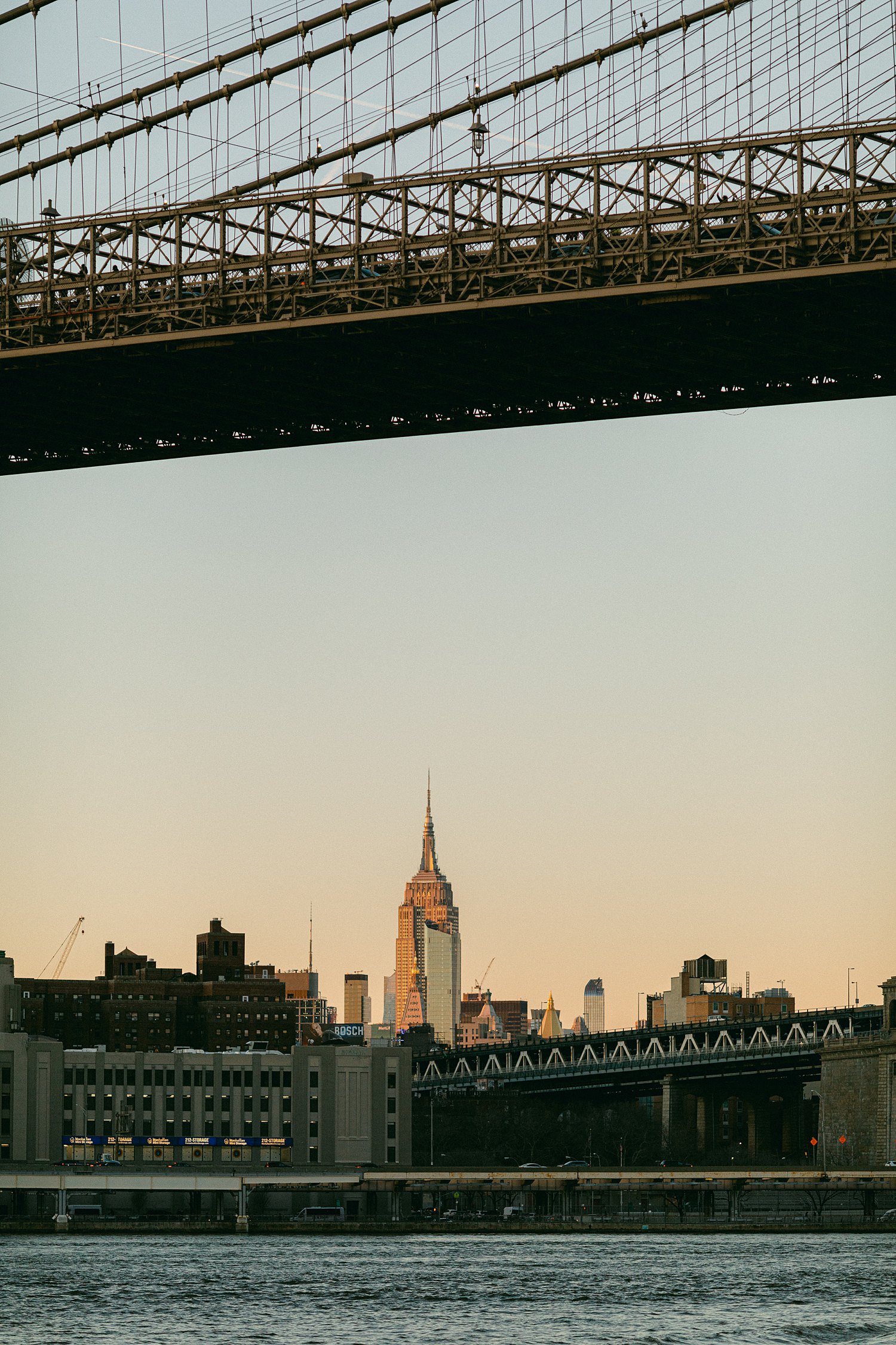 Empire State Building from the Brooklyn Bridge at sunset