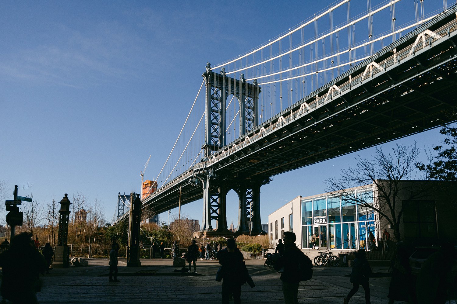 Manhattan bridge against blue sky NYC
