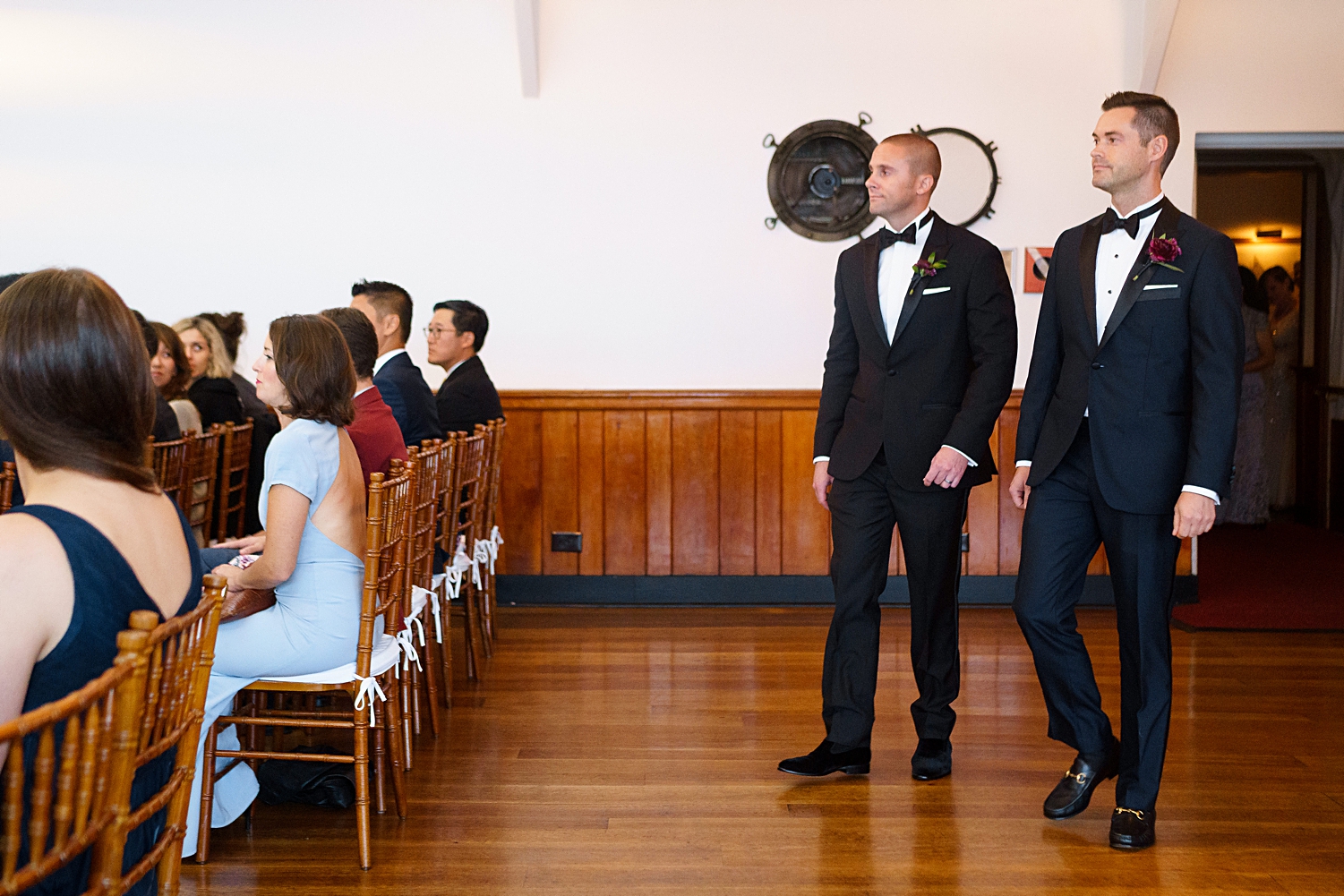 groom and best man walking to ceremony altar