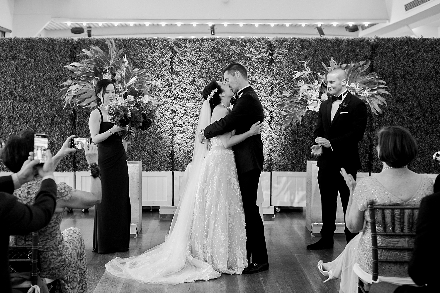 bride and groom first kiss at the water club new york city wedding