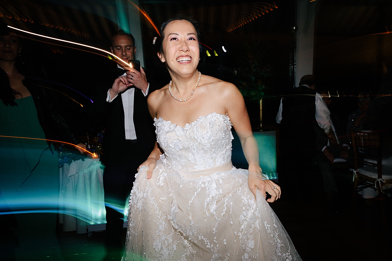 bride in wedding dress dancing at reception