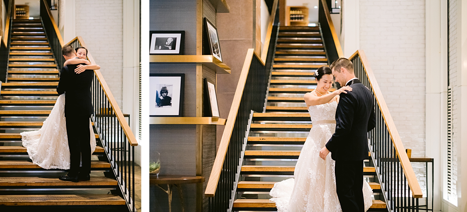 bride and groom hugging on staircase