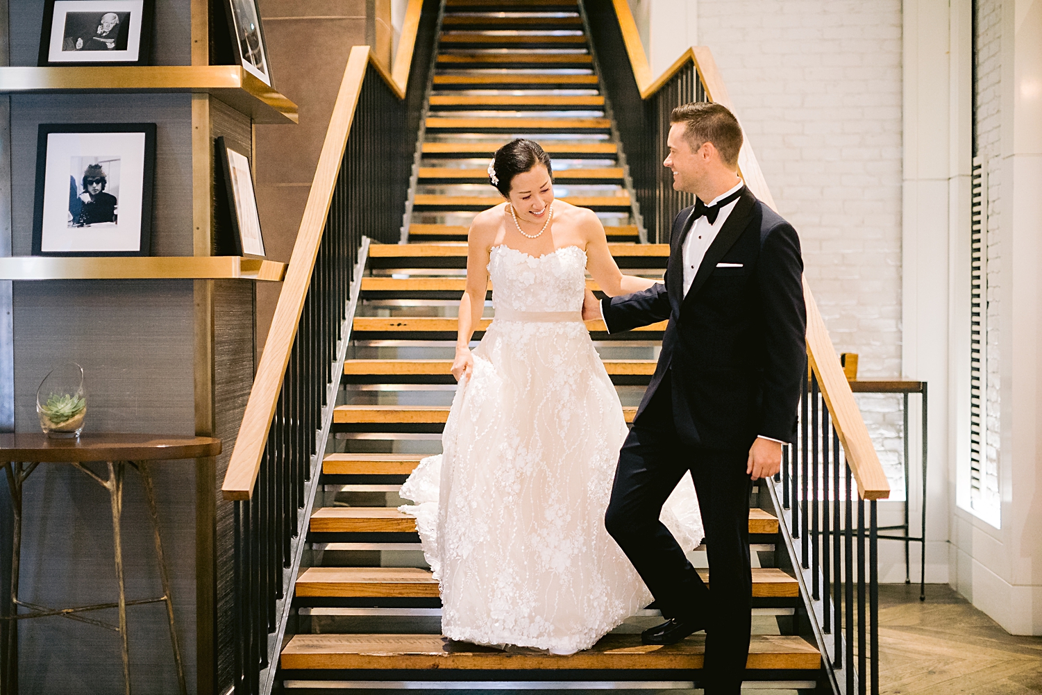 bride and groom walking down staircase in manhattan hotel