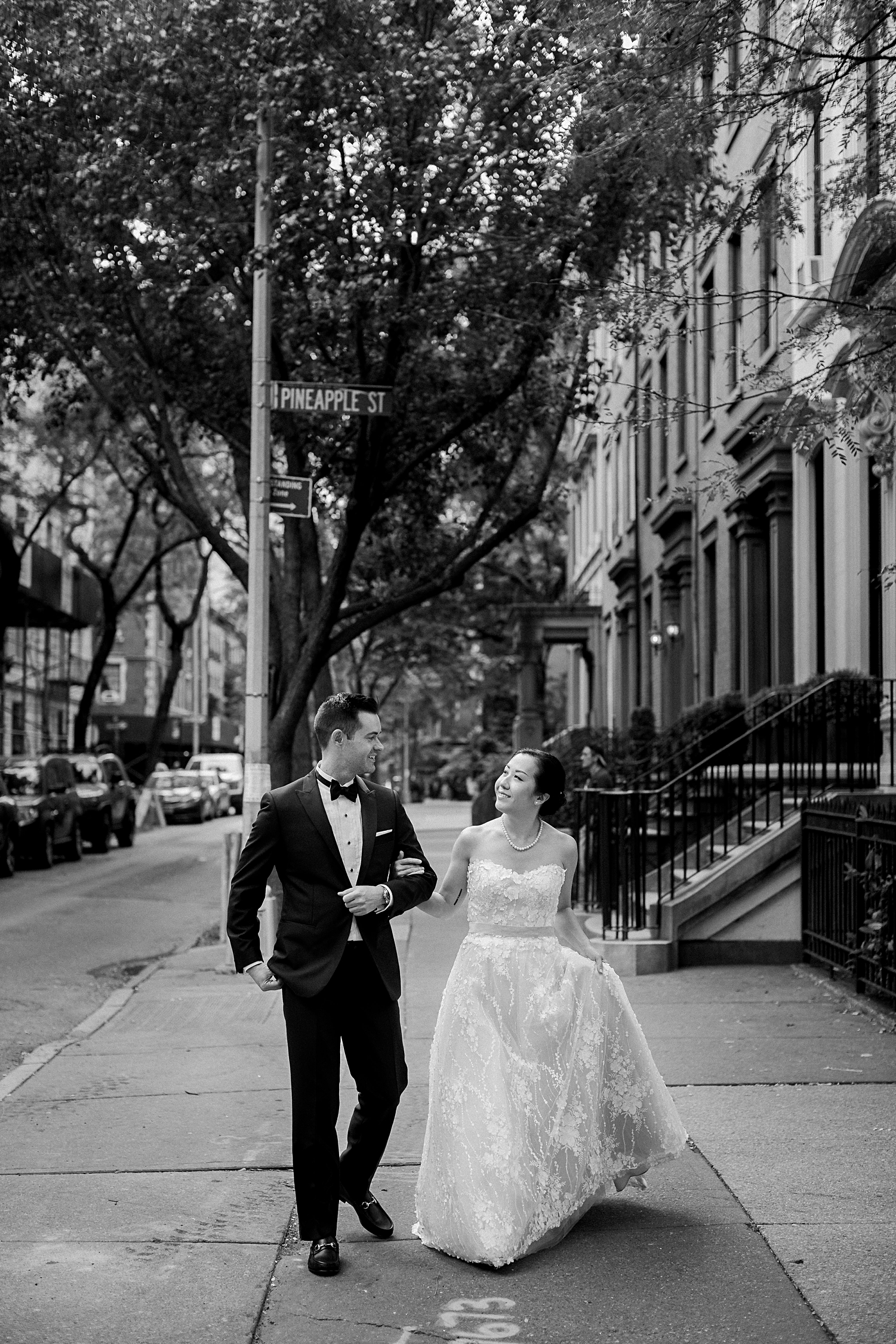 bride and groom walking on street brooklyn new york city wedding