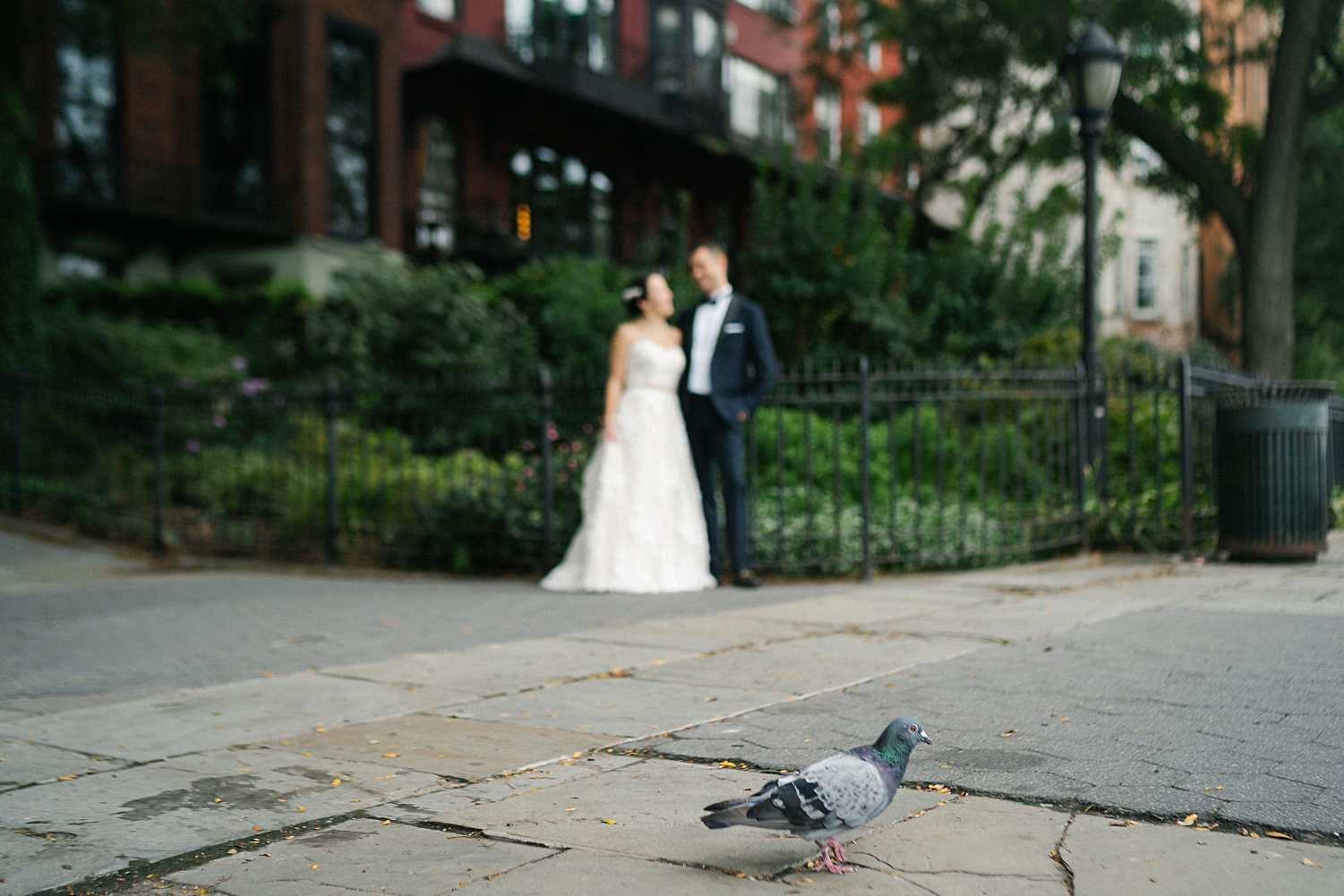 bride and groom standing in front of brooklyn brownstones new york city wedding