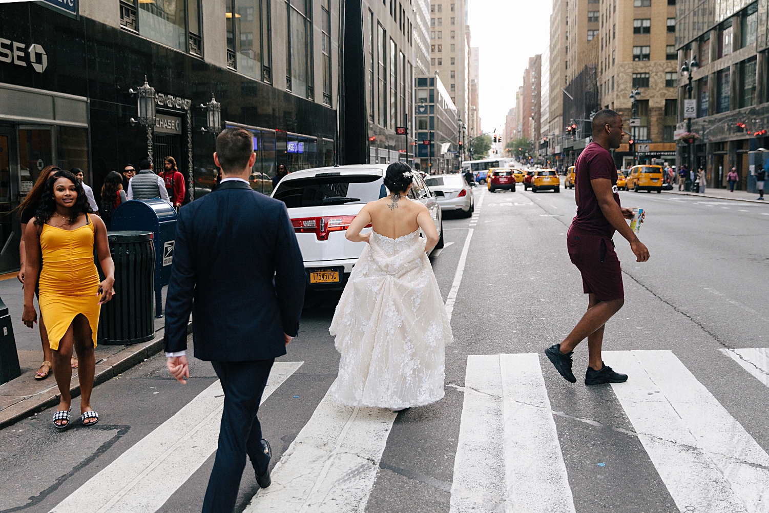 bride and groom walking on midtown manhattan street