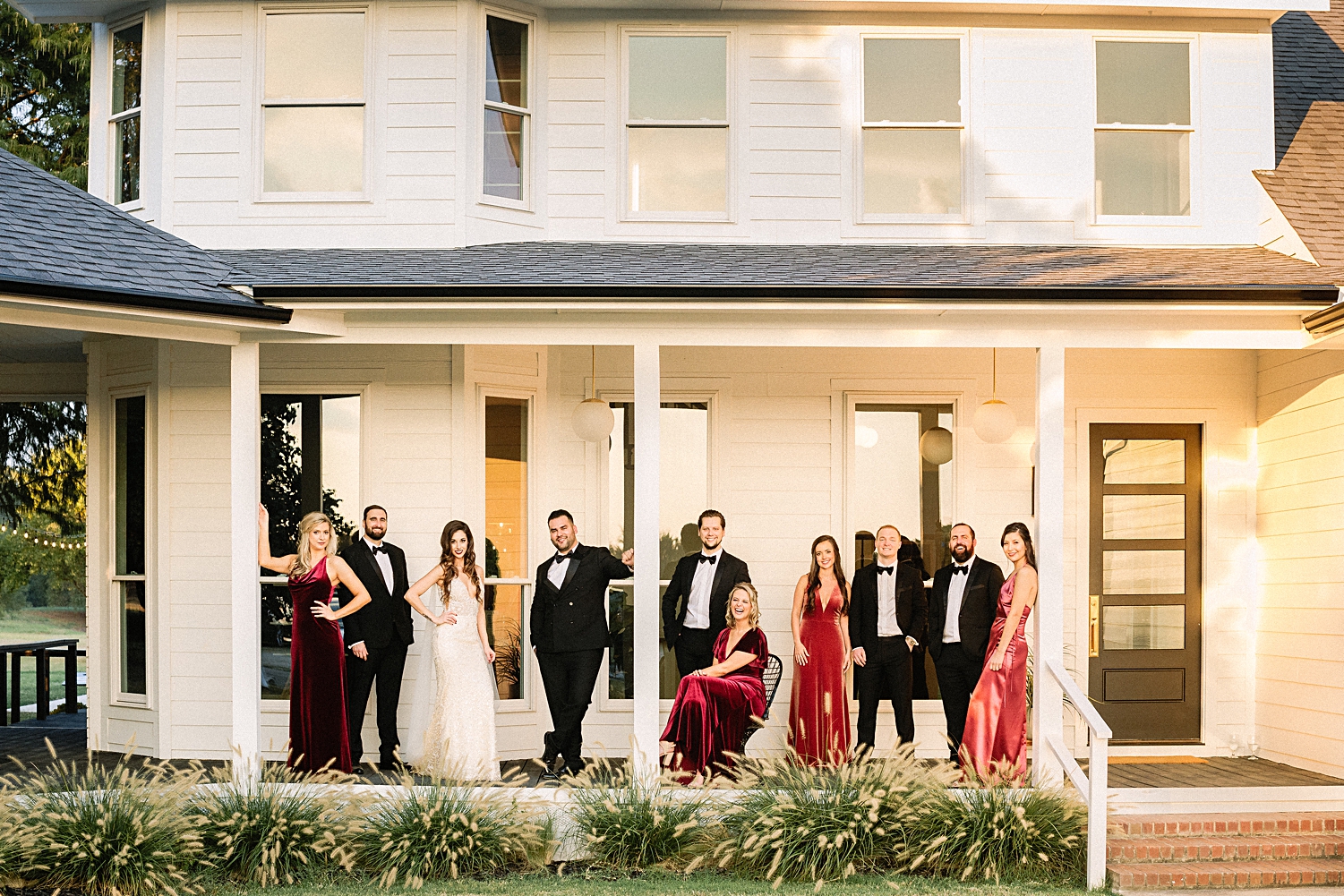 bride groom bridal party standing on porch of white Emerson Wedding Venue