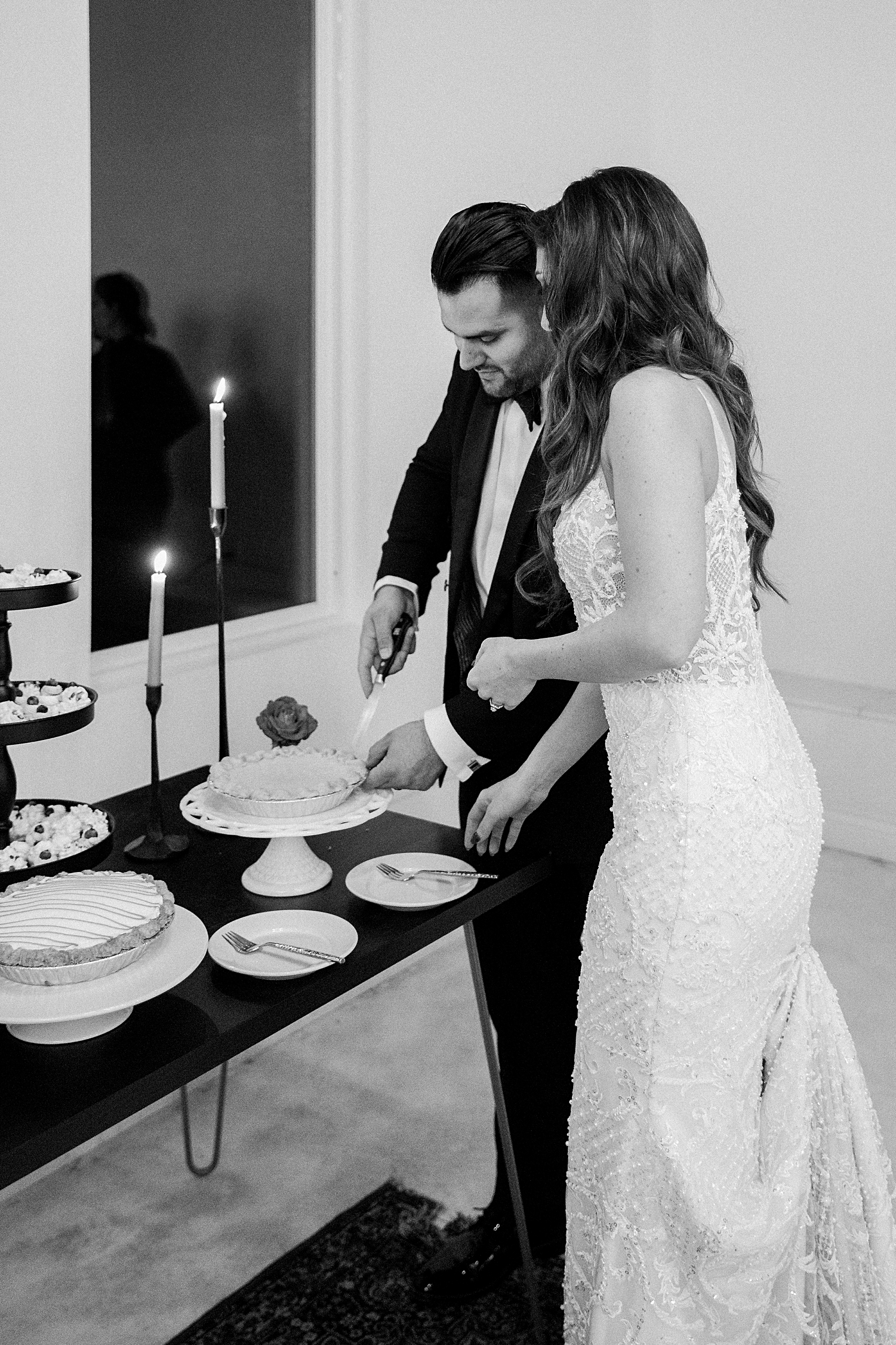groom and bride cutting pie at reception Emerson Venue Wedding