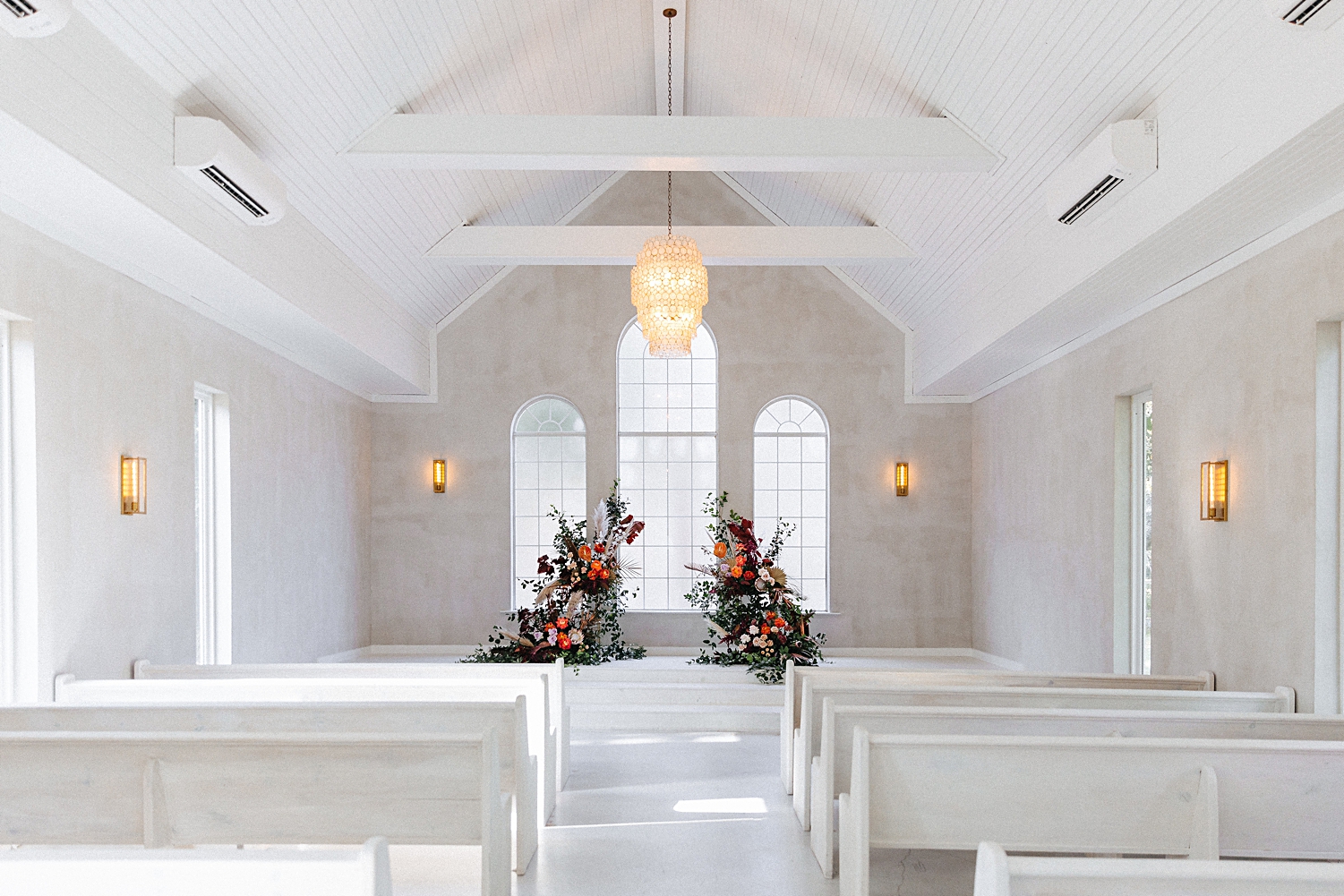 White chapel wedding altar floral instillation Emerson