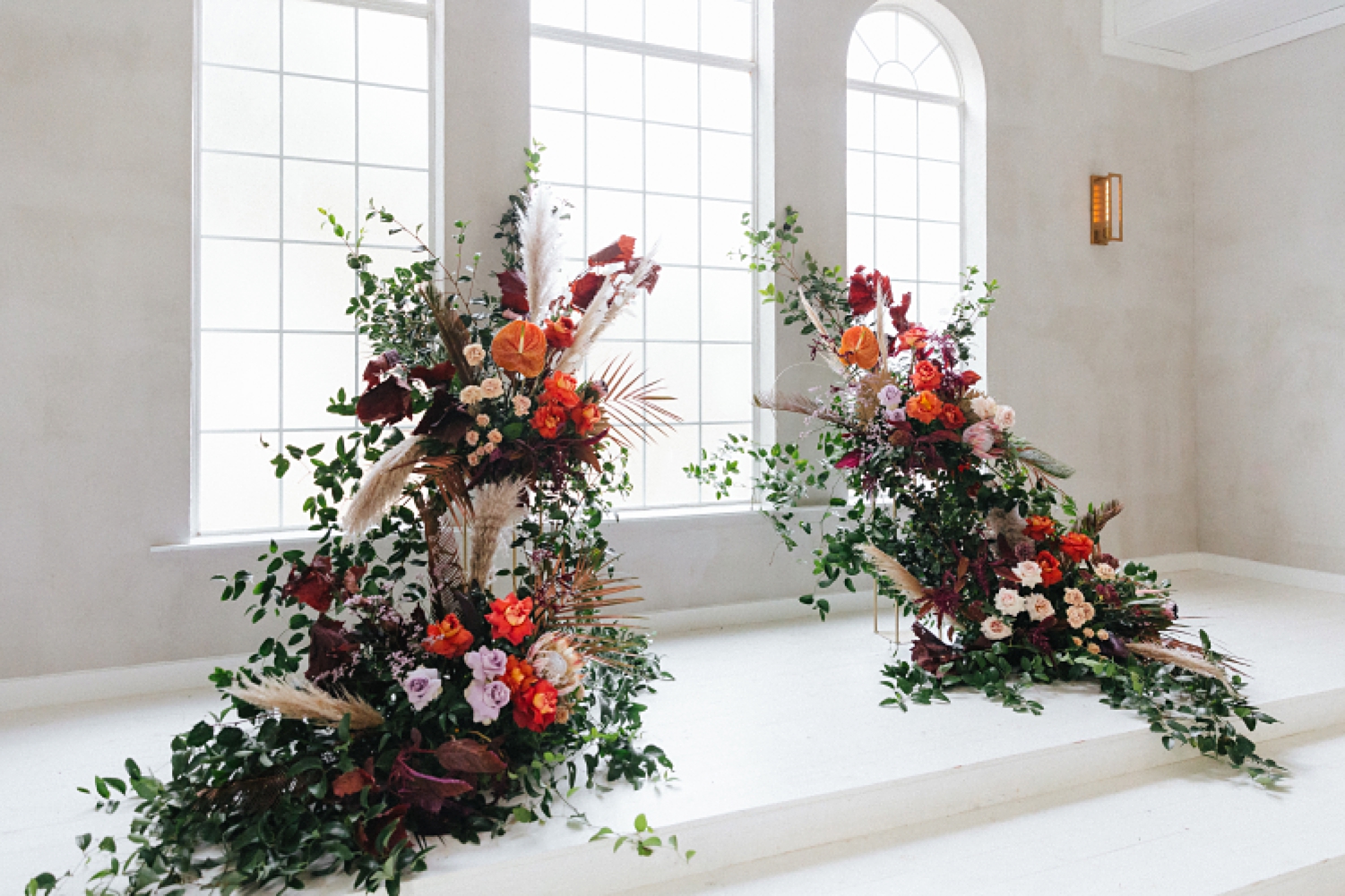 white chapel wedding altar floral orange purple Emerson