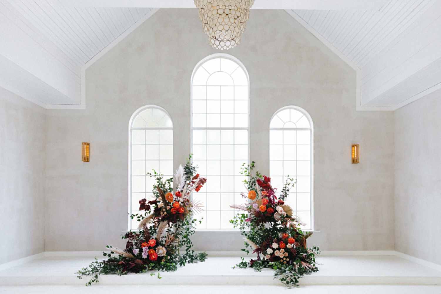  flowers wedding altar floral instillation orange purple Emerson white chapel windows